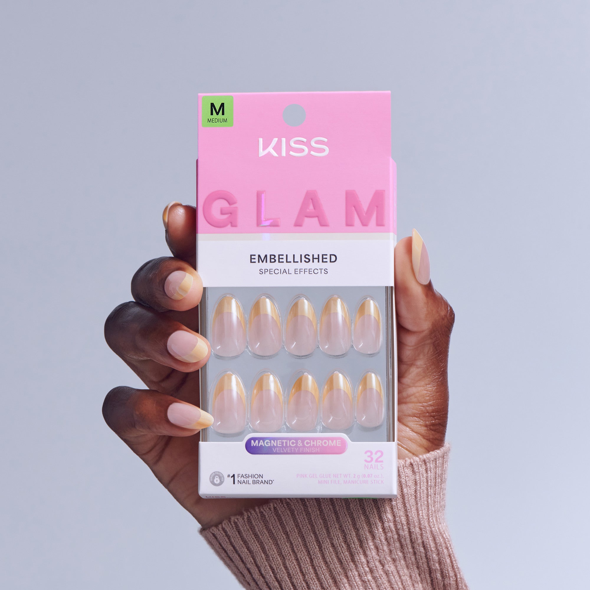 KISS Glam Embellished Medium Nails in magnetic chrome finish, displayed in packaging held by hand.