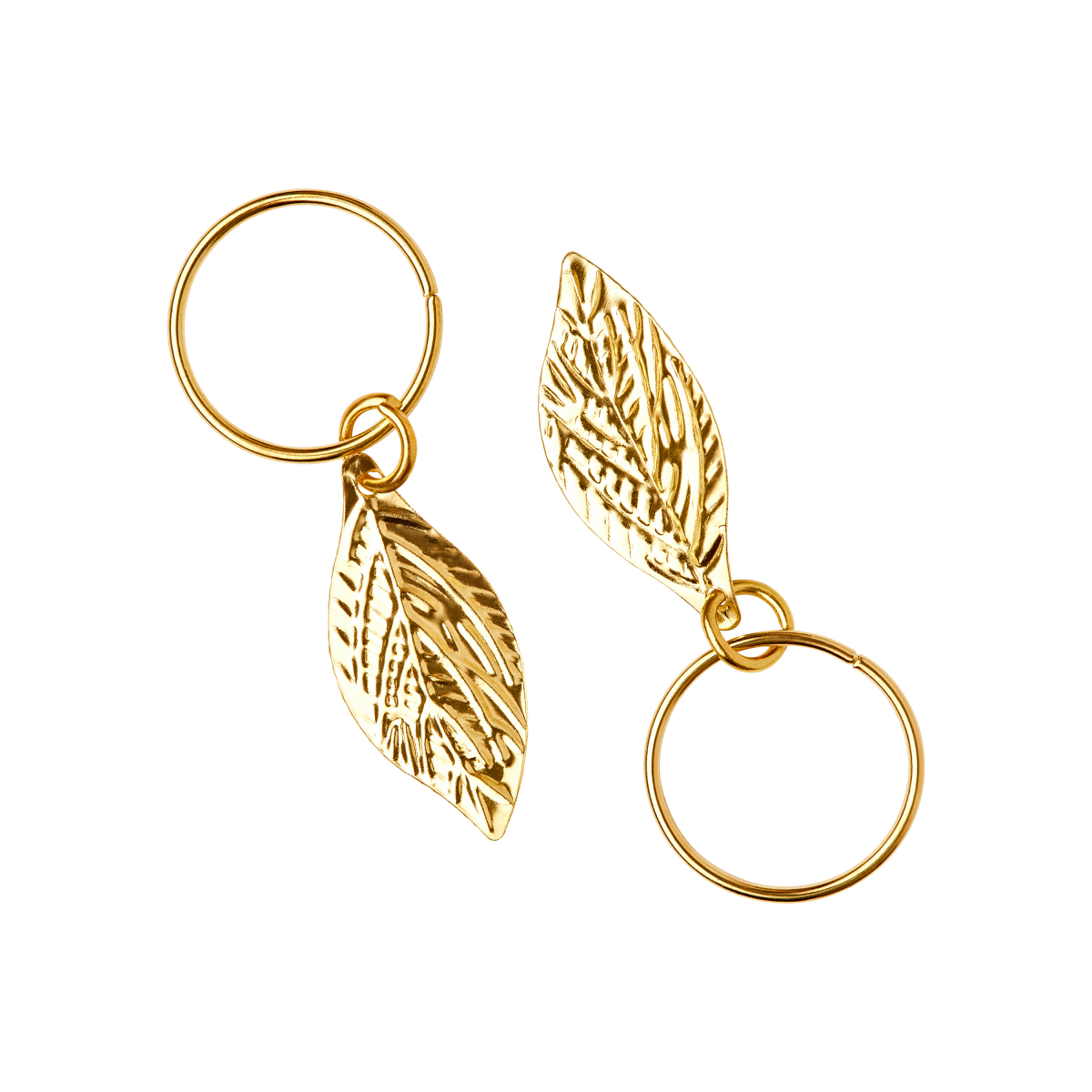 Two gold-tone braid charm rings featuring textured leaf-shaped charms, displayed on a white background for clear detail.