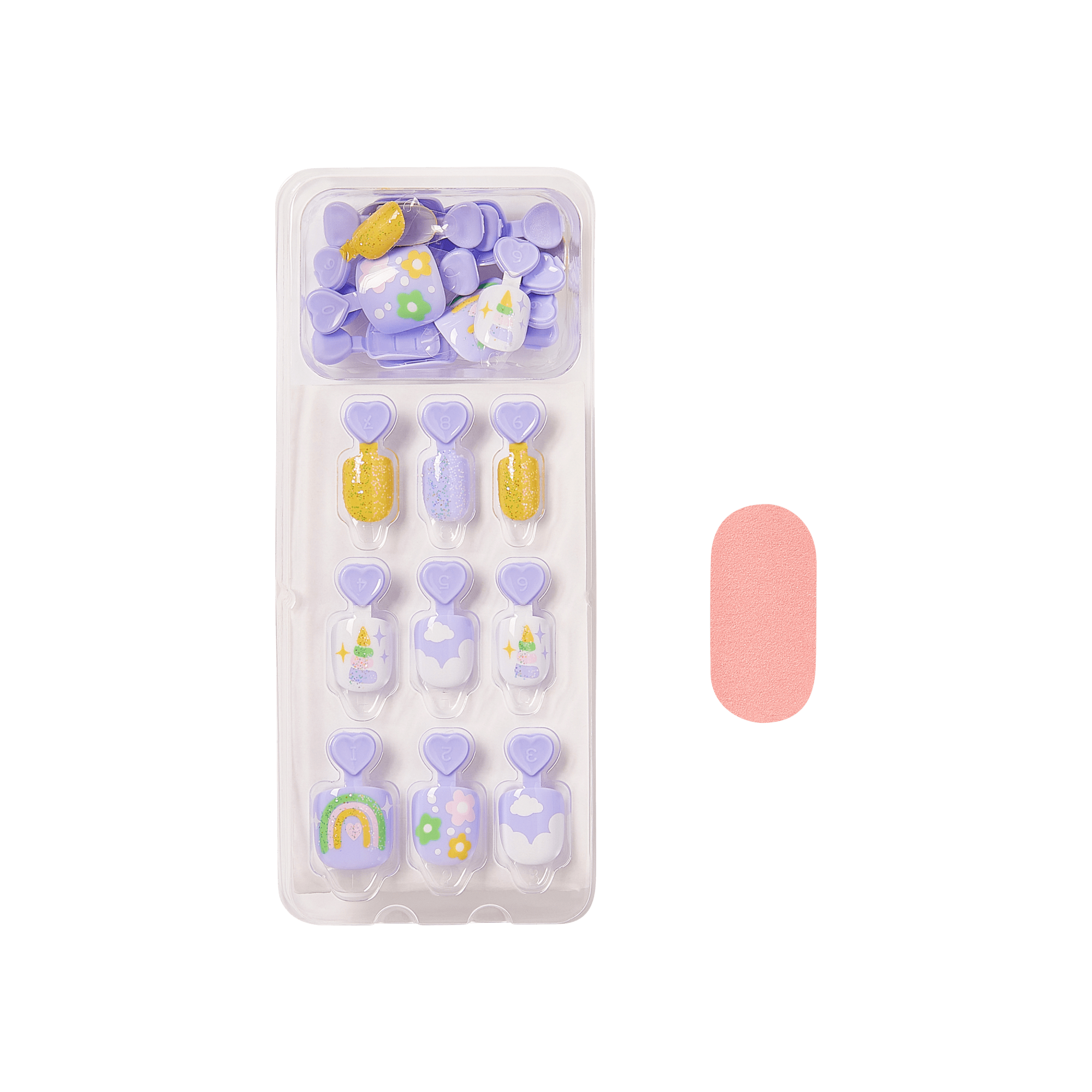 The image features a set of decorative press-on nails arranged in a clear plastic tray. The nails are predominantly in shades of purple and include various designs, such as rainbows, flowers, and glitter accents. There are also a few solid-colored nails, with one being a soft pink color placed next to the tray. The overall aesthetic is playful and colorful, suitable for a fun and trendy nail look.