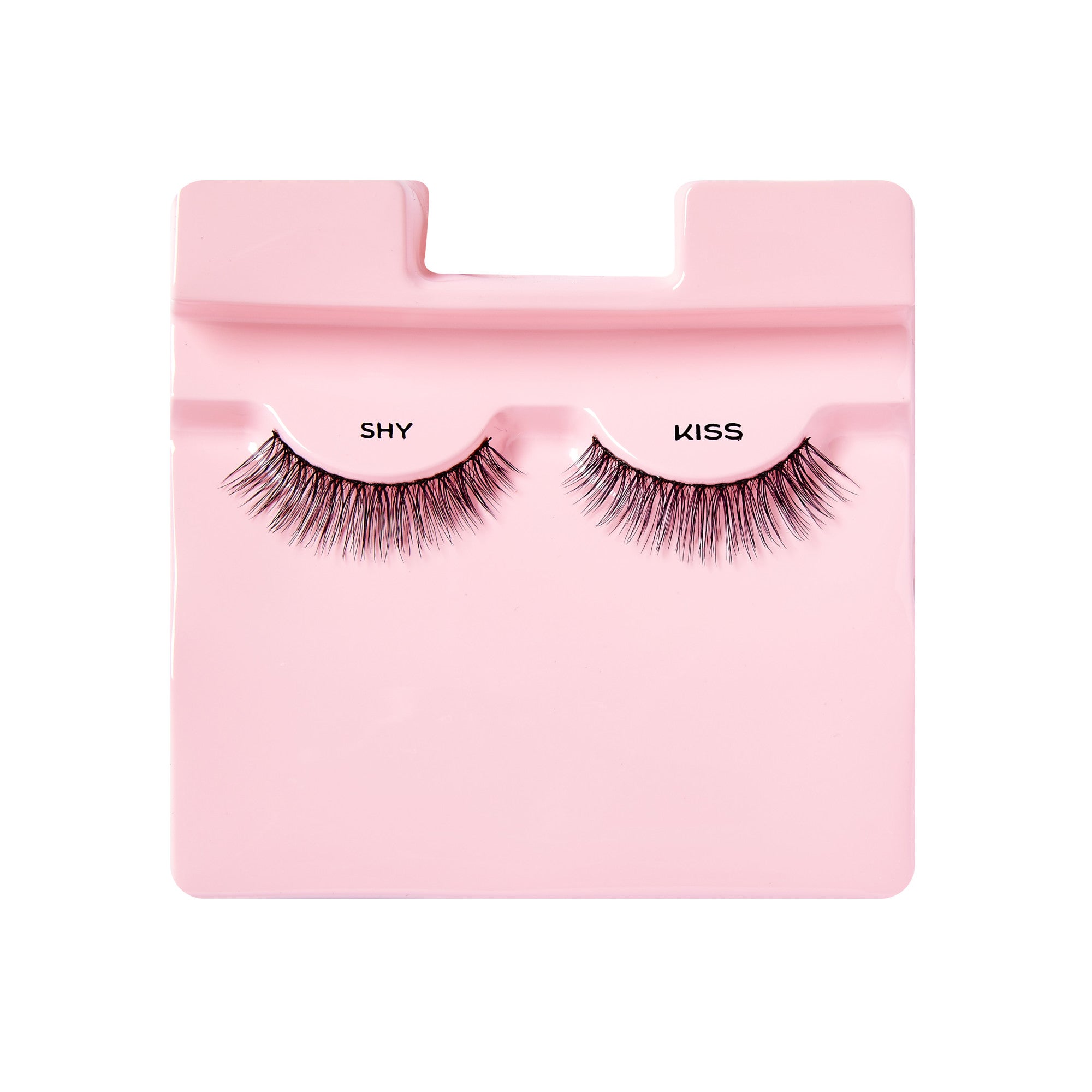 Pair of black false eyelashes with a natural style, displayed on a light pink plastic tray labeled \