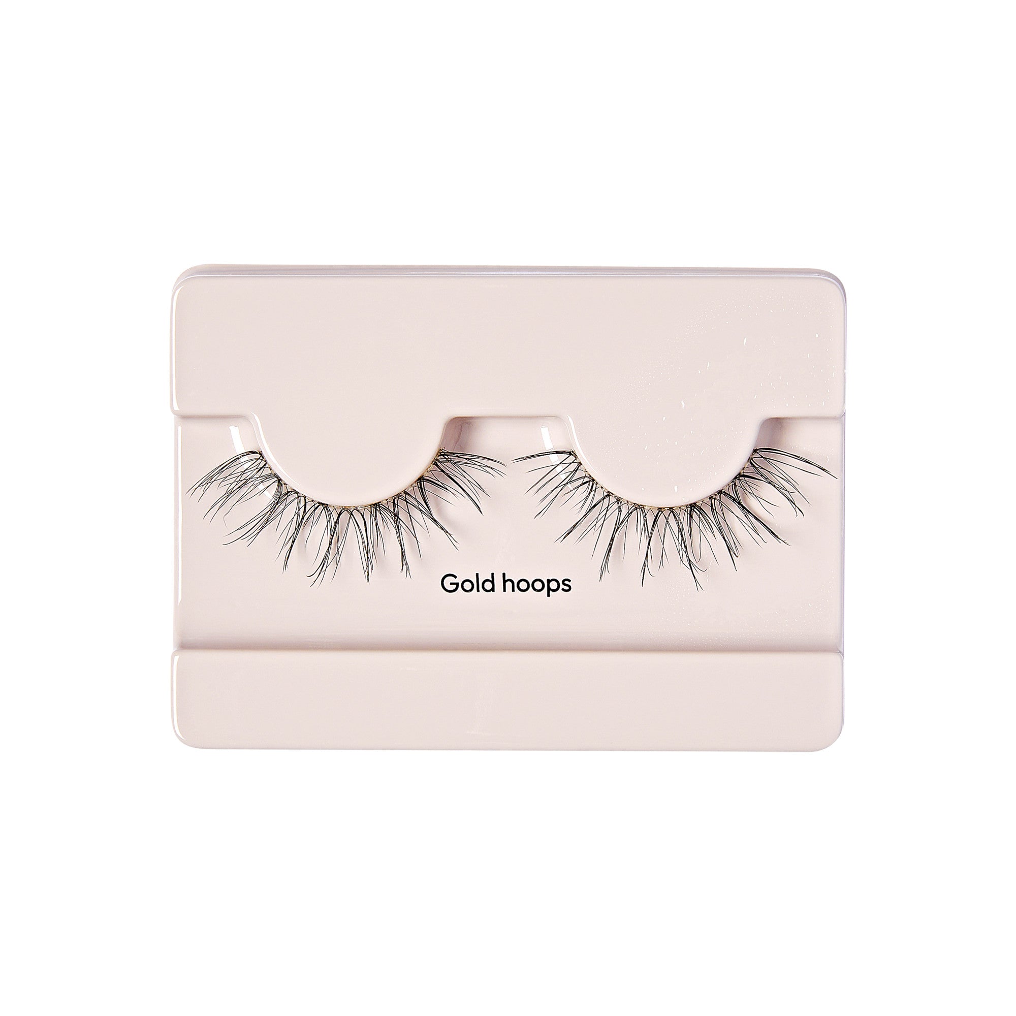 The image shows a pair of false eyelashes packaged in a light-colored rectangular case. The eyelashes are labeled "Gold hoops" and are displayed in a way that they are curved to mimic the natural shape of eyelashes. The packaging is simple and minimalistic, with the eyelashes being the main focus.