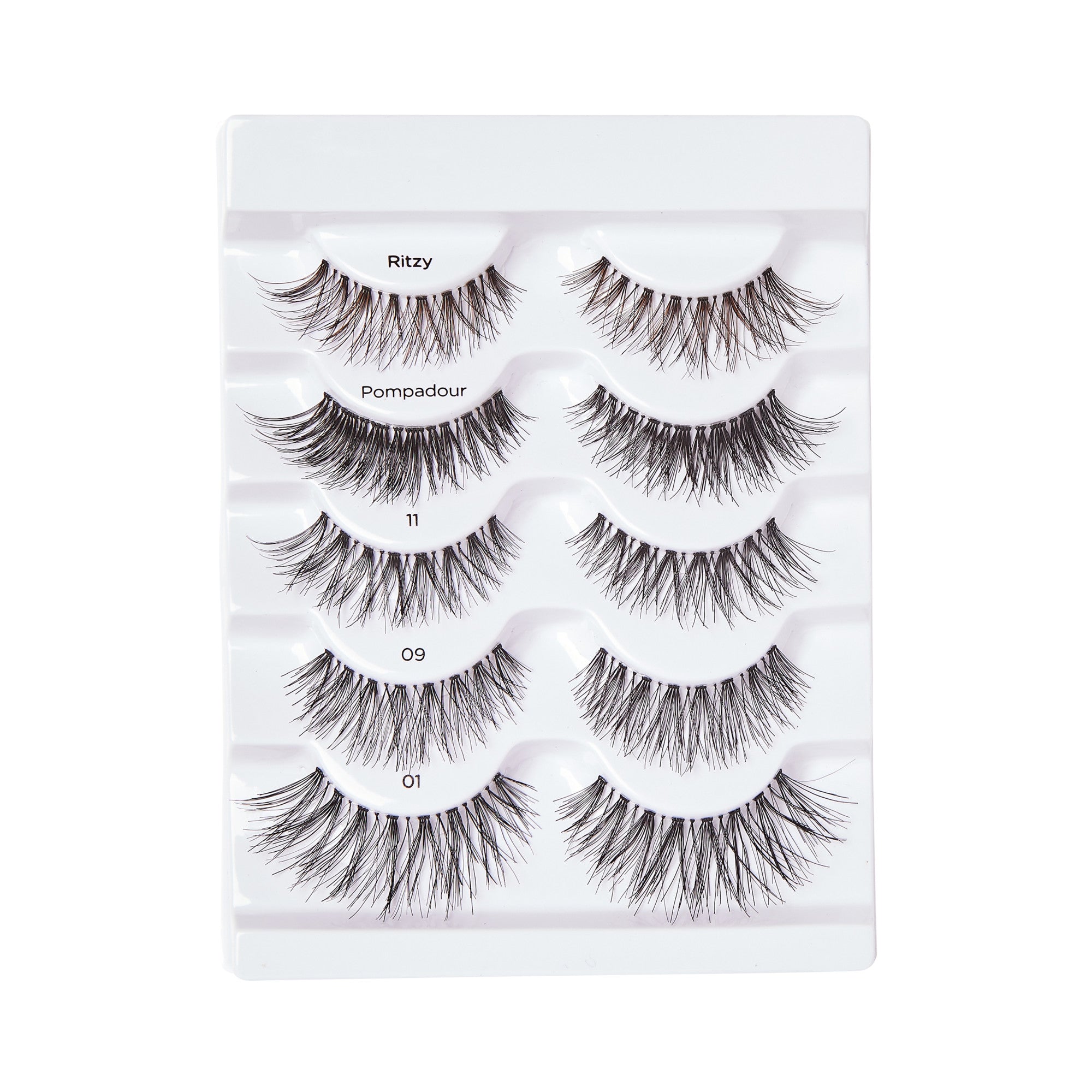 Five pairs of black false eyelashes displayed on a white plastic tray, each labeled with style names: Ritzy, Pompadour, 11, 09, and 01.