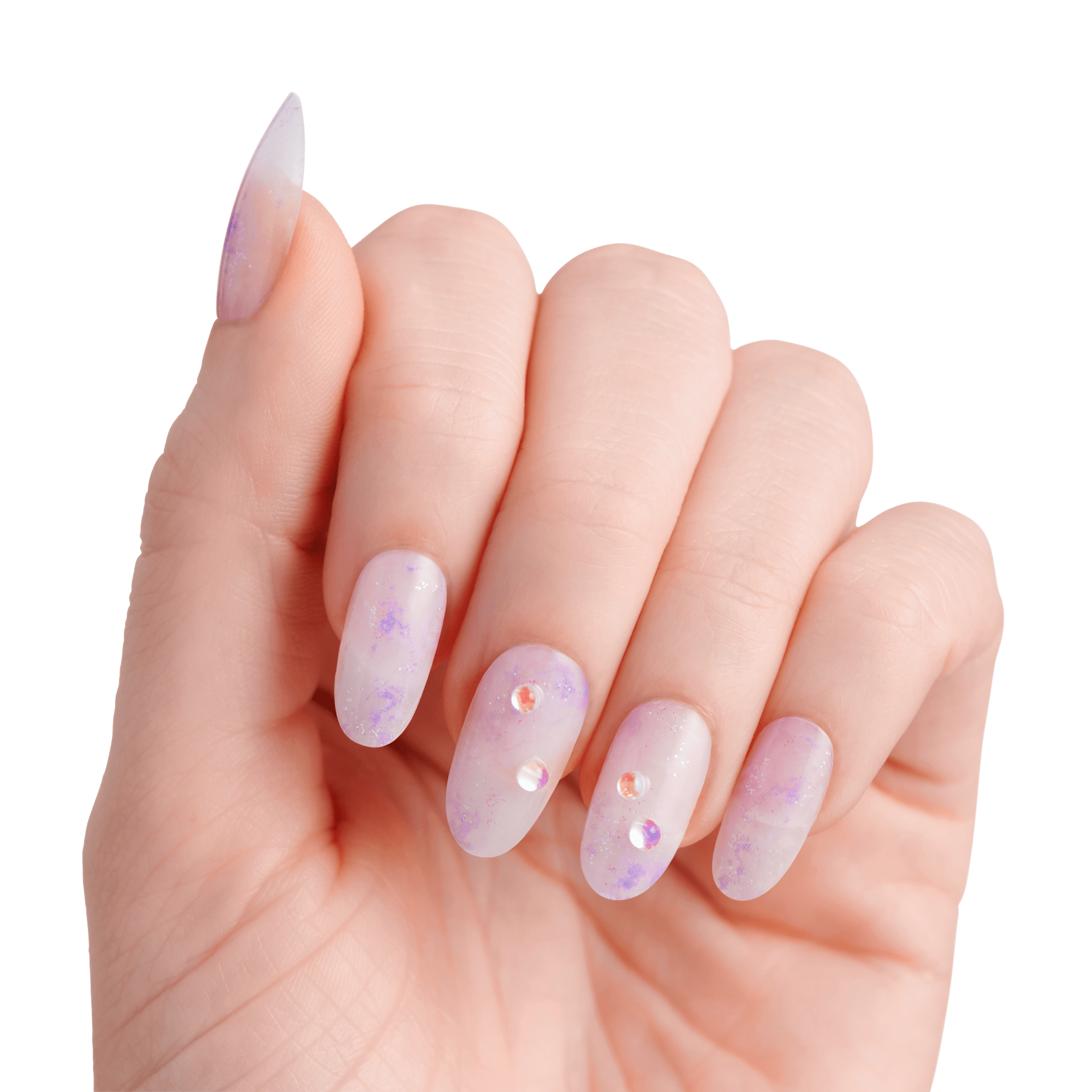 The image features a hand displaying elegantly manicured nails. The nails are long and shaped into a pointed style, showcasing a soft, translucent lavender color with a subtle gradient effect. Some nails are adorned with small, sparkling rhinestones, adding a touch of glamour. The overall look is delicate and stylish, set against a clean white background that emphasizes the beauty of the nails.