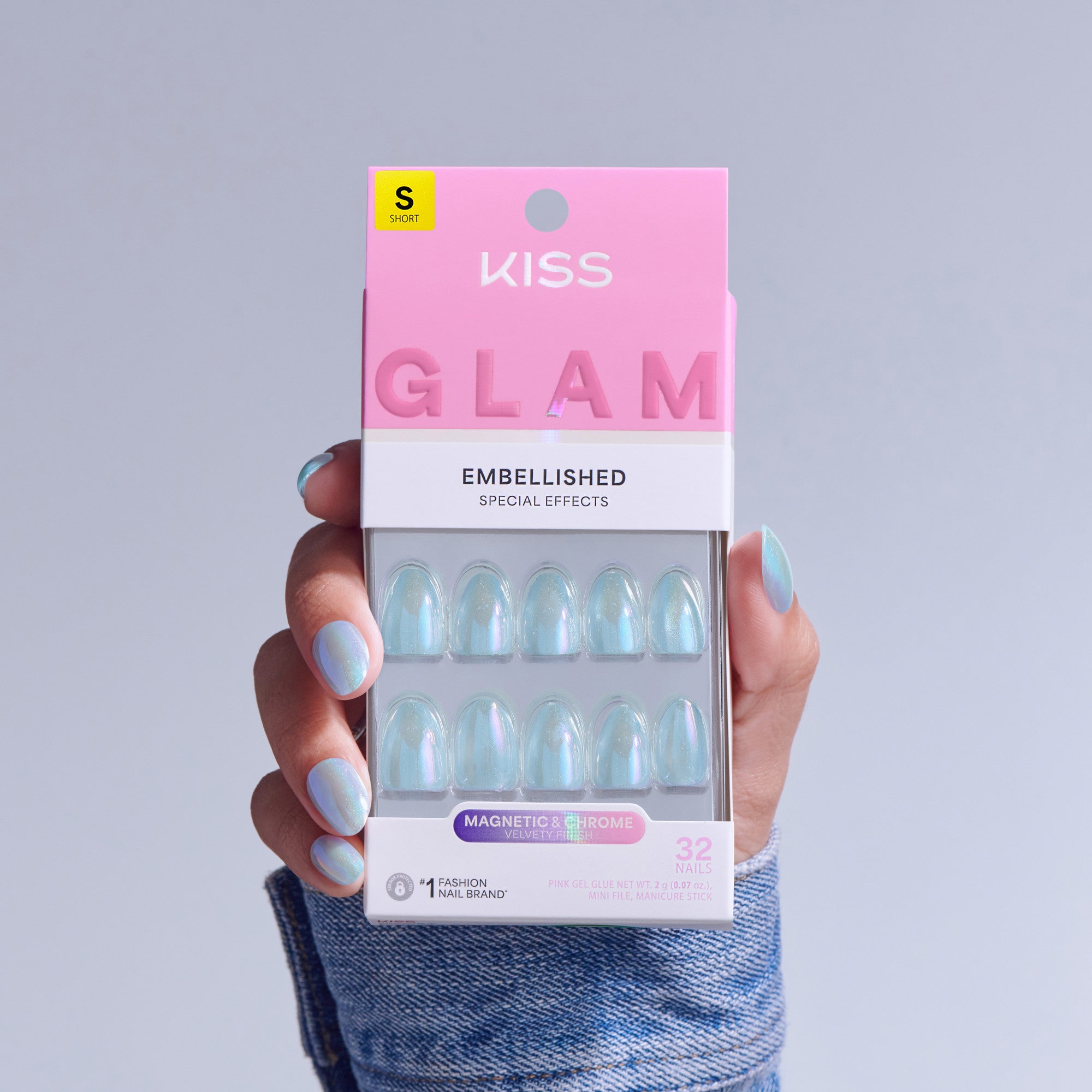 Kiss Glam Embellished press-on nails in iridescent blue, size short, held in hand