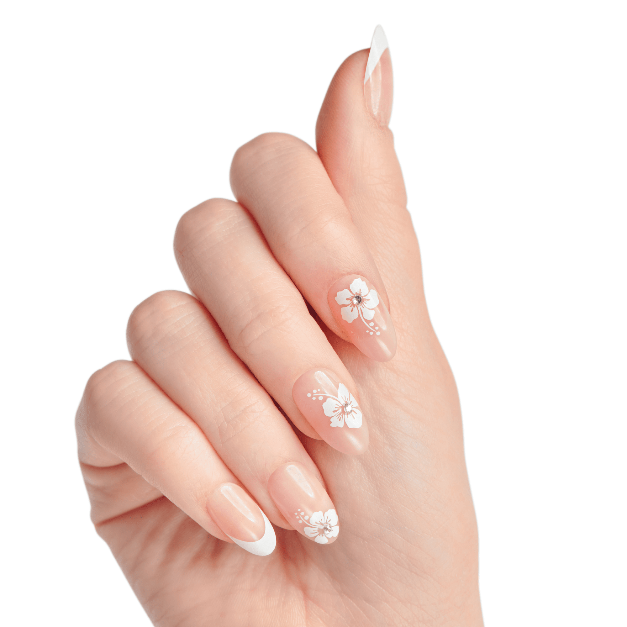 Hand with natural-toned press-on nails featuring white floral designs with small rhinestones on three nails and a classic white French tip on two nails, shown against a white background.