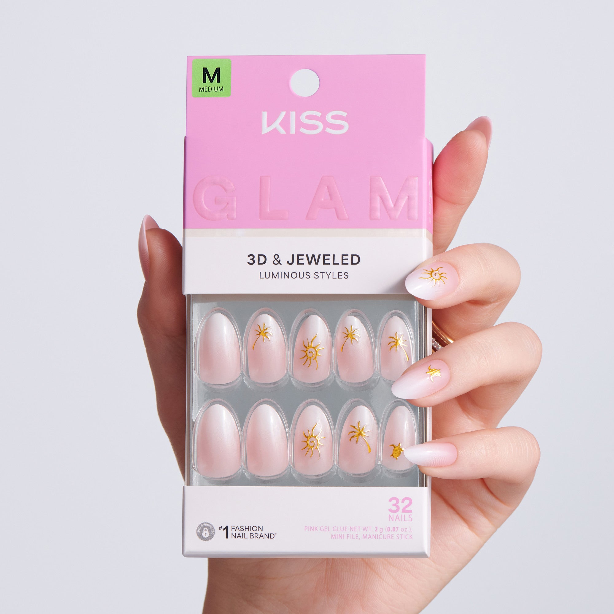 Kiss Glam 3D & Jeweled nail art packaging held by a hand with matching nails.