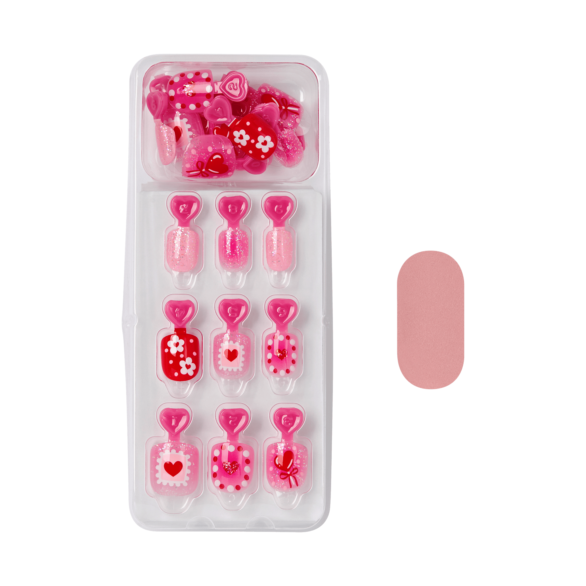 Pink press-on nails with heart-shaped toppers and decorative designs in display case.