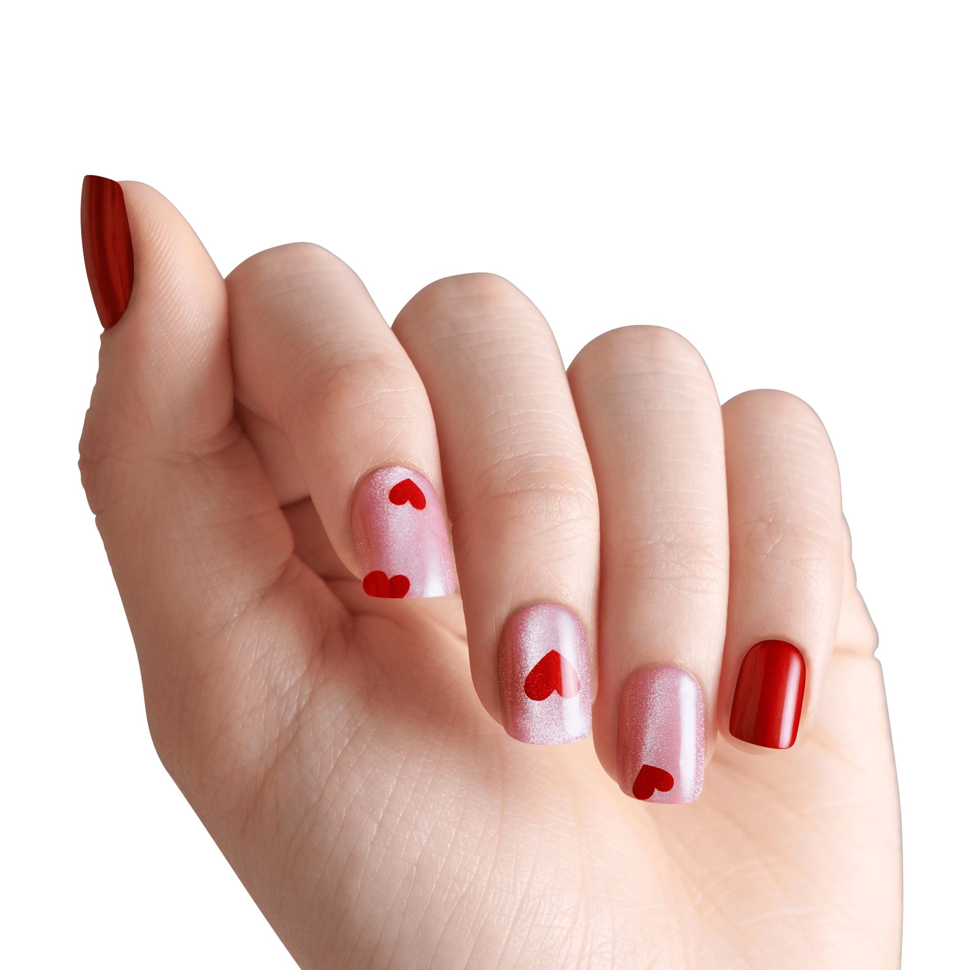 Red and pink nail polish manicure with heart designs on white background