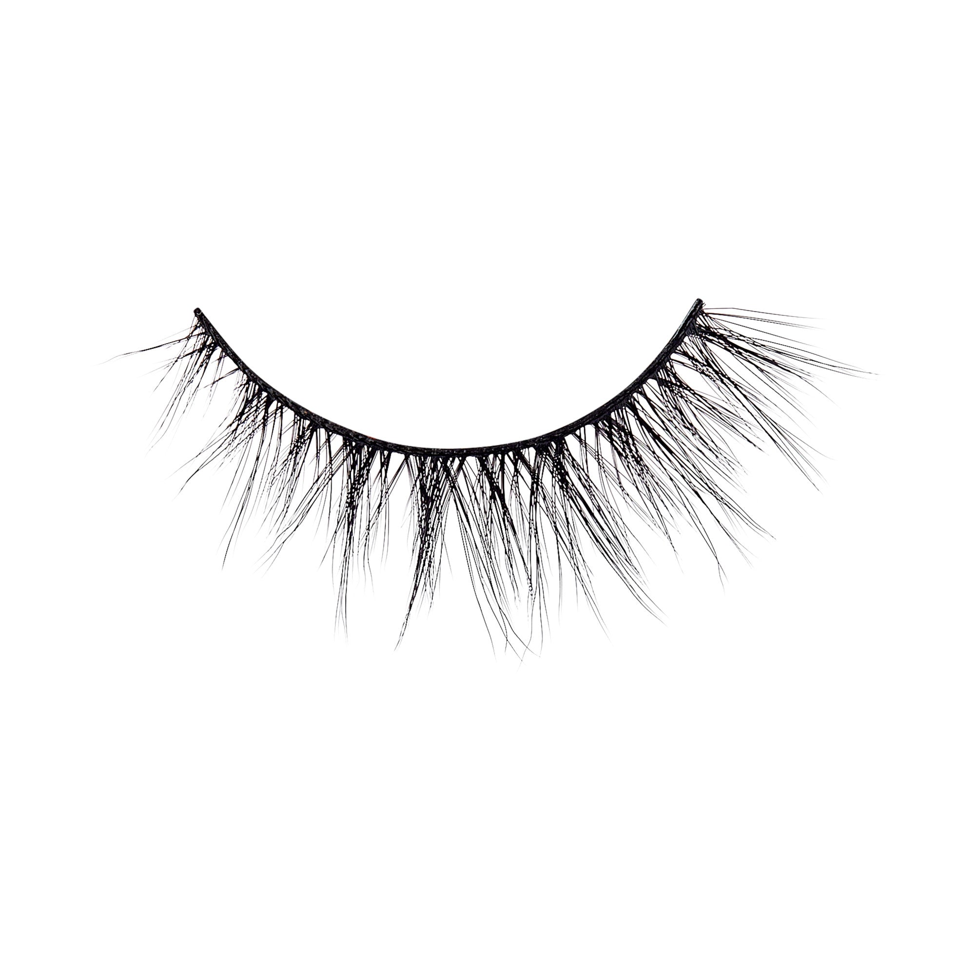 The image shows a single false eyelash. The eyelash is black and features a wispy, voluminous design with varying lengths of individual lashes. The base of the eyelash is a thin, flexible strip that is used to adhere the false eyelash to the eyelid. The lashes are arranged in a natural, fluttery pattern, giving a dramatic and full appearance.