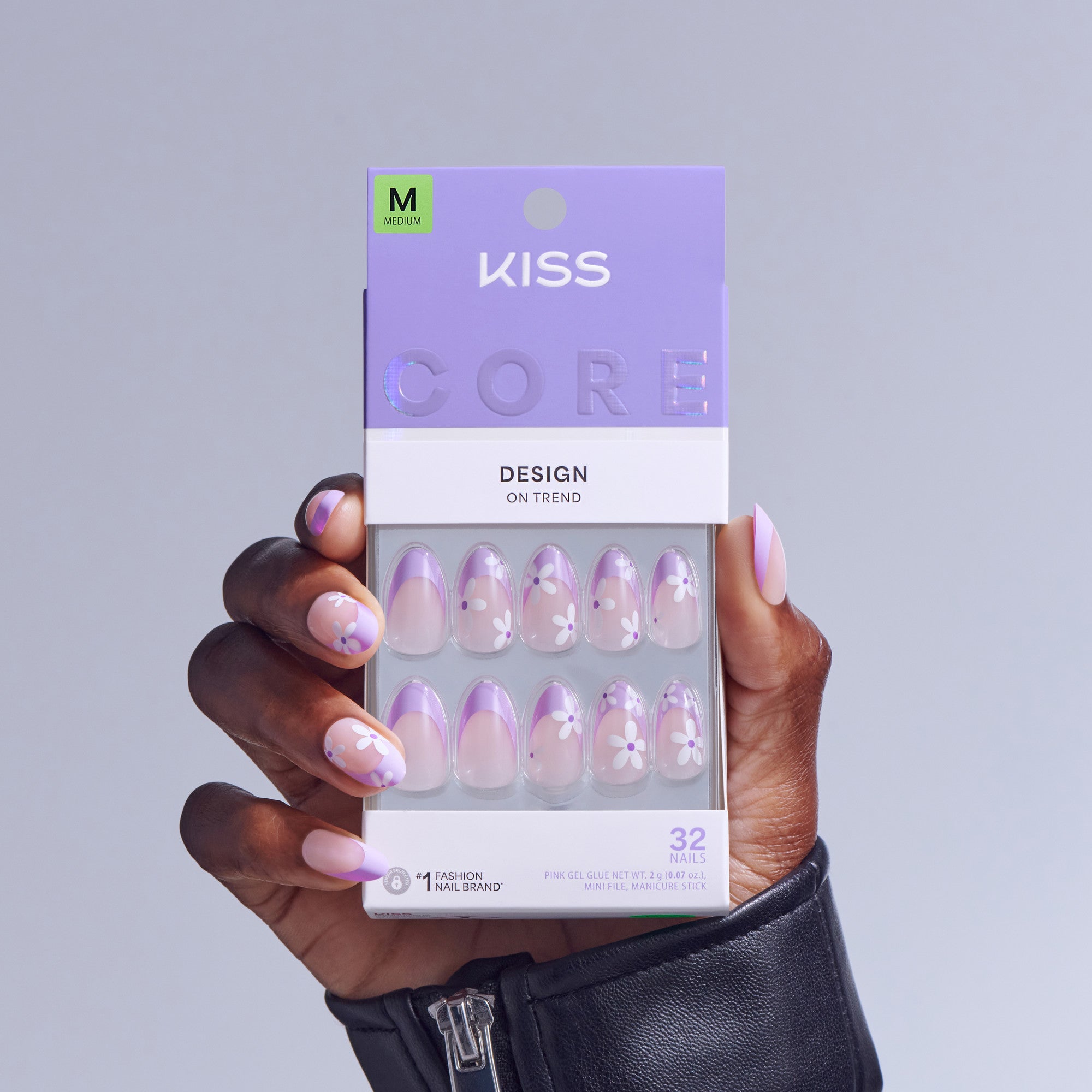KISS Core Design press-on nails in purple floral pattern, size M, displayed in packaging.