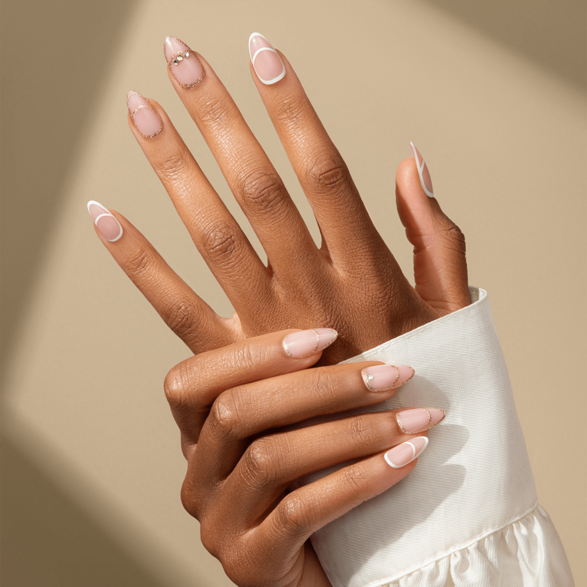 Two hands with medium brown skin tone display KISS Classy Premium Press On Glue Nails in the \