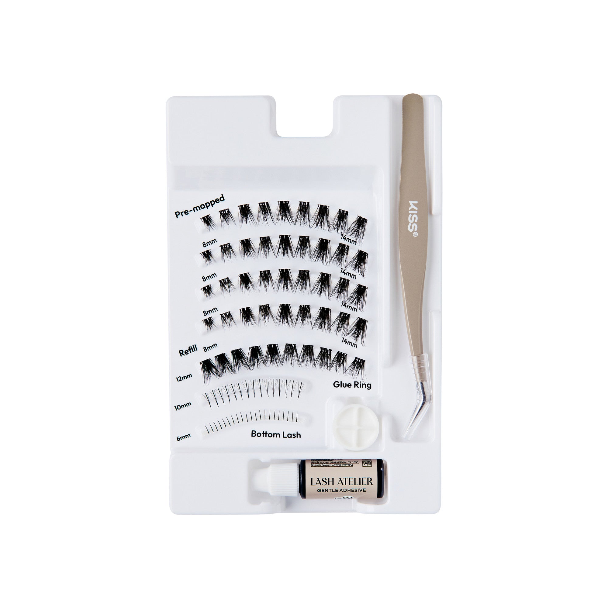 The image features a lash extension kit arranged on a white tray. The kit includes several rows of pre-mapped lash extensions in varying lengths, labeled for easy identification. There is also a glue ring for applying adhesive, a pair of tweezers for precise placement, and a small container labeled "LASH ATELIER." The overall layout is organized and designed for ease of use in lash application.