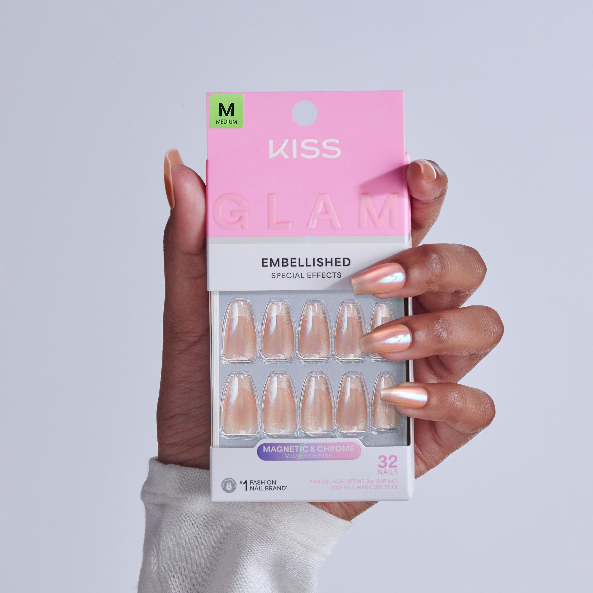KISS Glam Embellished Medium nails in magnetic chrome with velvet finish, 32-piece set displayed on hand.
