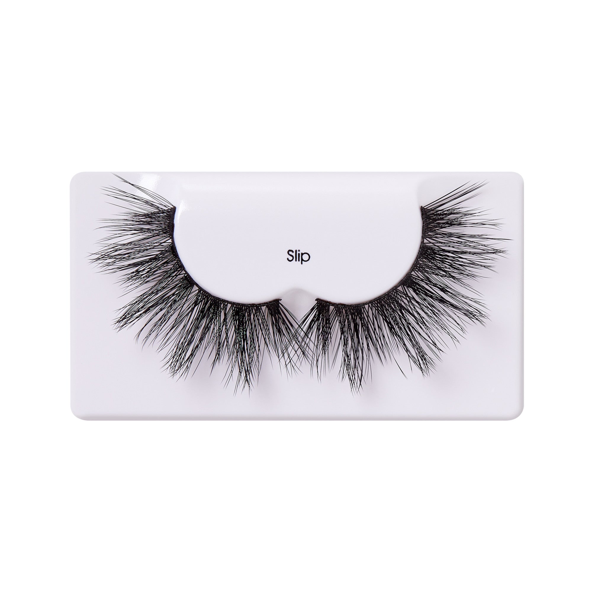 Pair of black, voluminous false eyelashes with a wispy, multi-layered design, displayed on a white tray labeled \