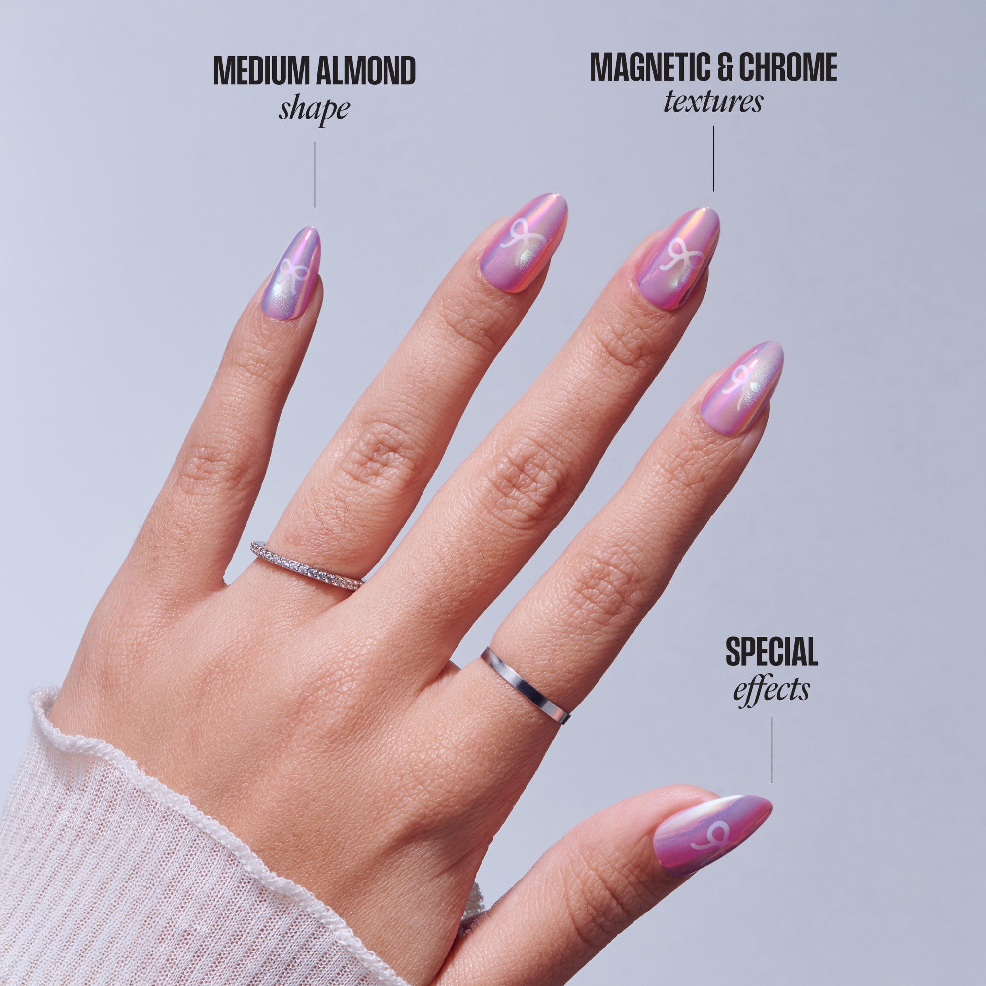 Medium almond nails with magnetic chrome and purple gradient designs featuring special effects.