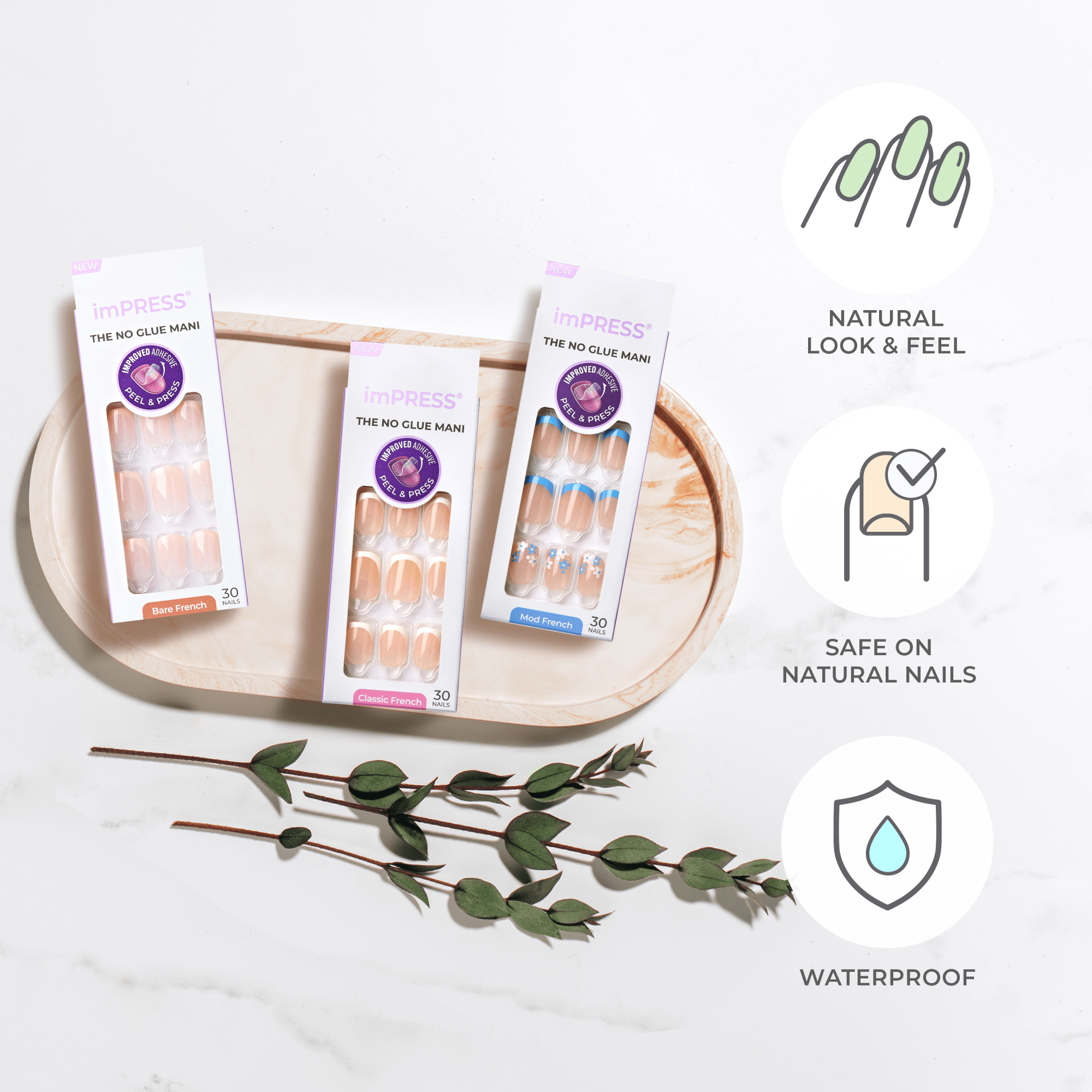Three packages of imPRESS press-on nails in Bare French, Classic French, and Mod French designs are displayed on a beige tray, accompanied by green leafy sprigs. The text highlights that the nails offer a natural look and feel, are safe on natural nails, and are waterproof.