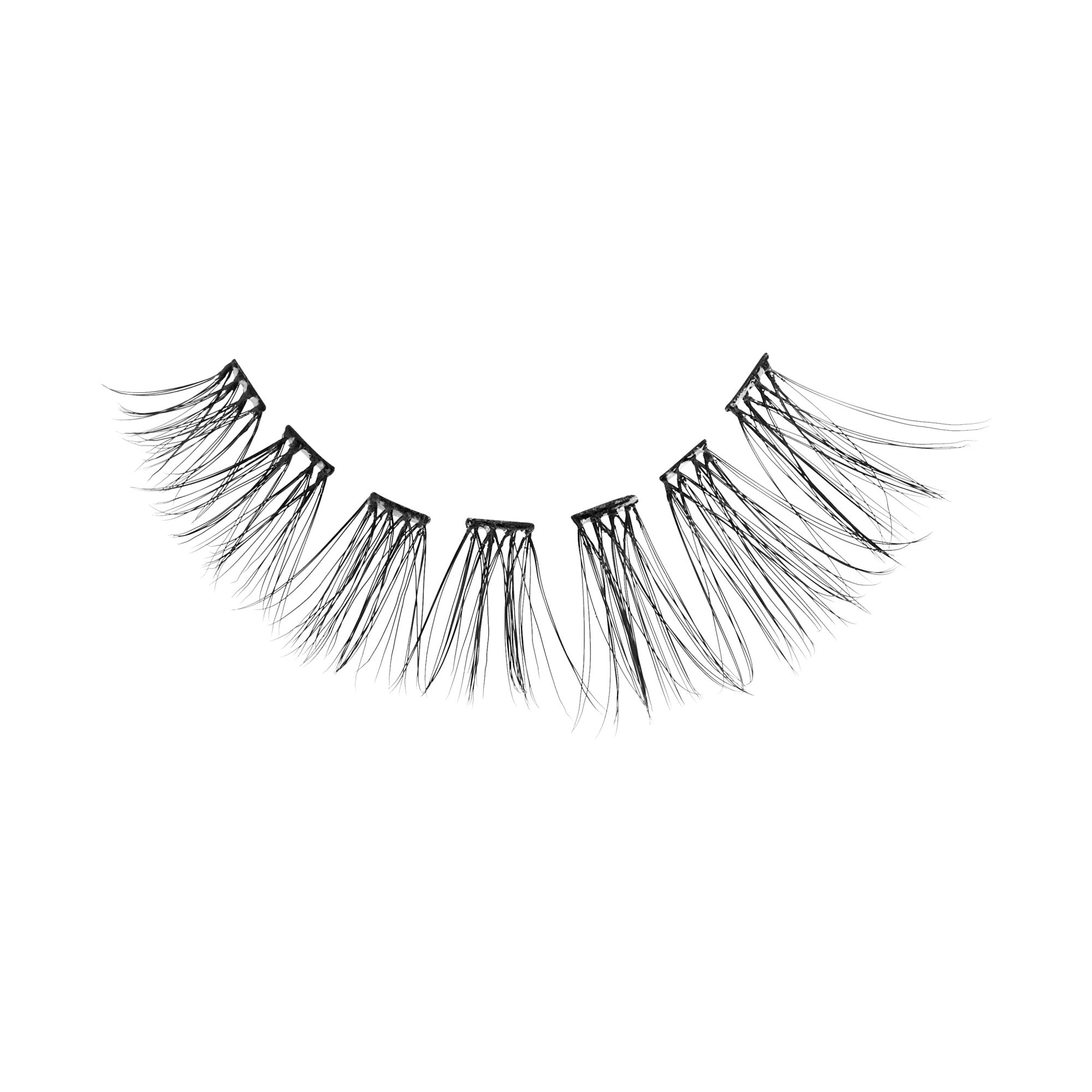 False eyelashes with layered, wispy black strands on white background.