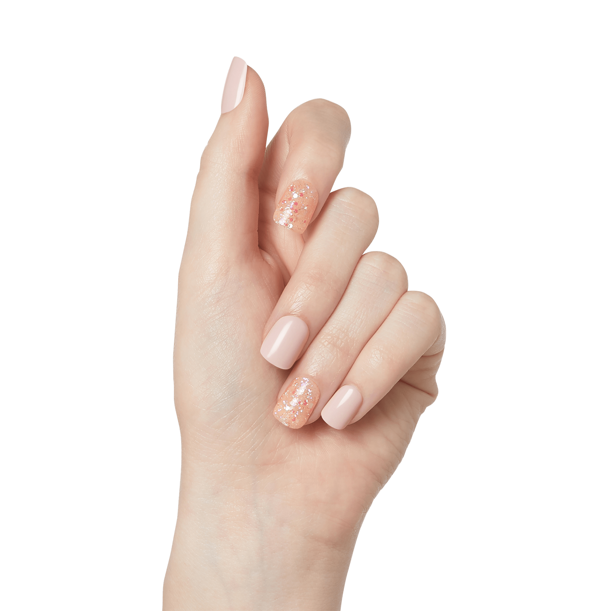 The image shows a close-up of a hand with a manicure. The nails are medium-length and have a light, nude pink polish. The ring finger has a different design, featuring a glittery, sparkly finish with a mix of colors, adding a decorative accent to the otherwise uniform manicure. The hand is positioned against a plain white background.