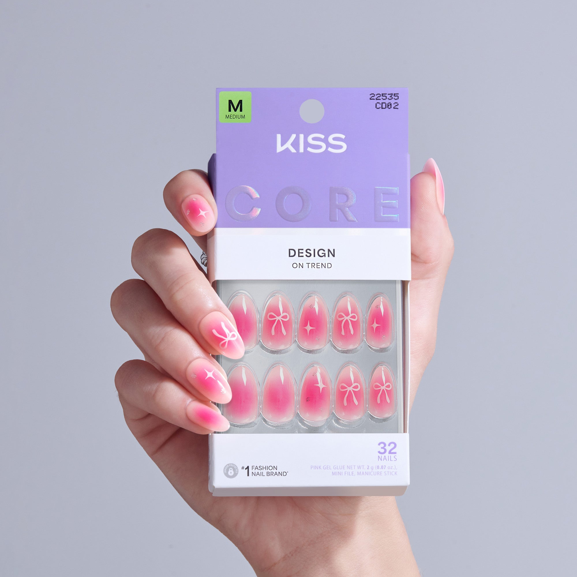 KISS Core Design On Trend press-on nails in pink with bow and star designs, size M, 32 nails.
