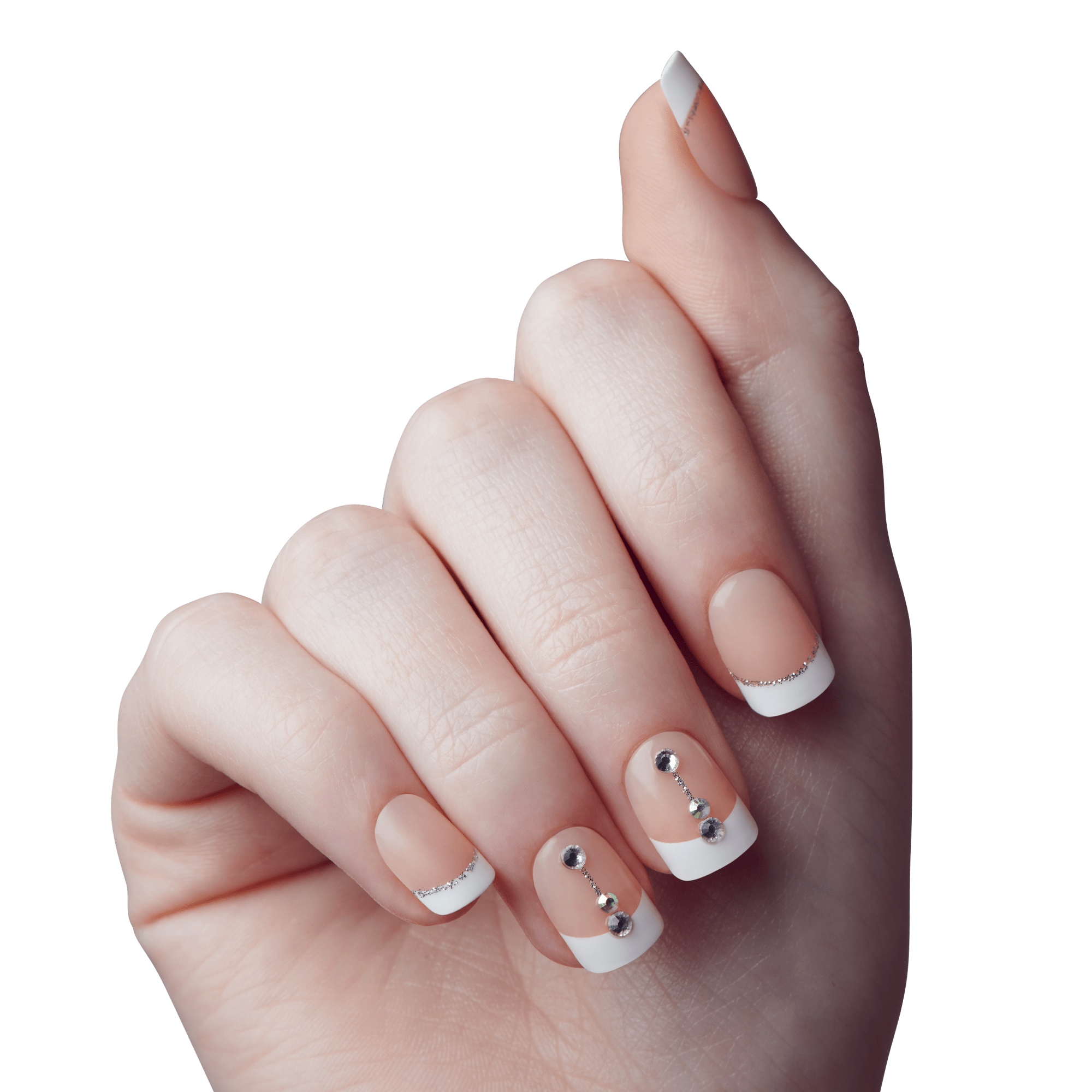 The image shows a close-up of a hand with a French manicure. The nails are neatly trimmed and feature a classic French tip design with white tips. Additionally, the nails are adorned with small decorative elements, including tiny rhinestones and metallic studs, arranged in a vertical line on each nail. The background is a plain, neutral gray, which helps to highlight the details of the manicure. The overall appearance is elegant and well-groomed.