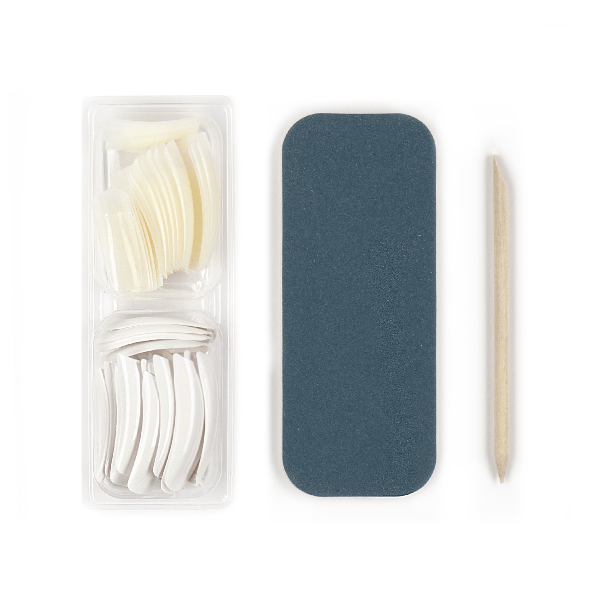 Clear plastic tray with natural and white French acrylic nail tips, blue rectangular nail file, and wooden cuticle pusher on a white background.