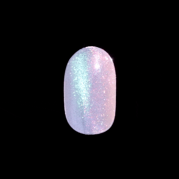 Single press-on nail shown close-up with an iridescent glitter finish that shifts between pale blue and soft pink hues on a black background.