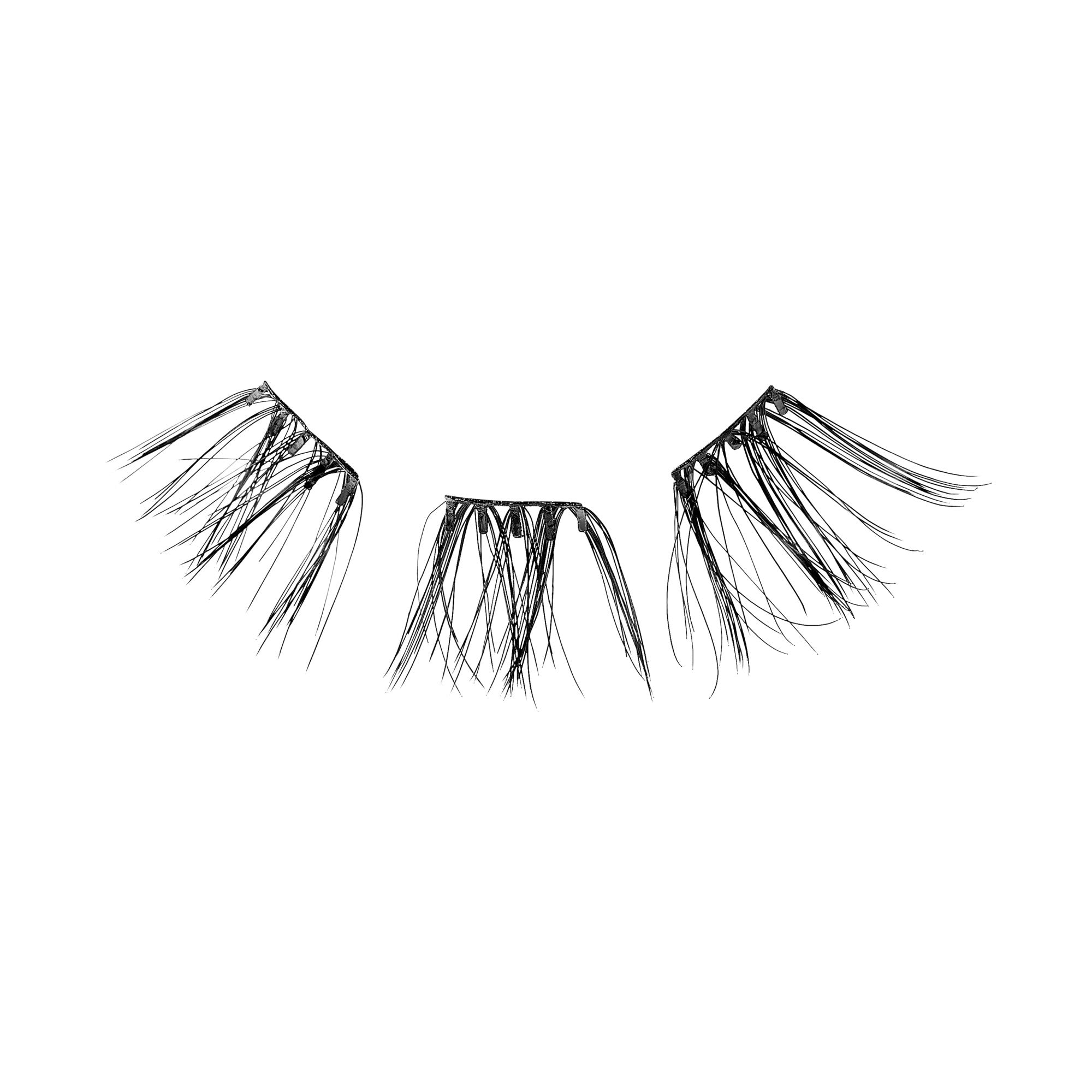The image shows a set of false eyelashes. The eyelashes are divided into three separate clusters, each with a natural, wispy appearance. The lashes are black and appear to be designed for enhancing the outer corners of the eyes, providing a fuller and more dramatic look. The clusters are arranged in a way that suggests they are meant to be applied individually to achieve a customized lash effect.