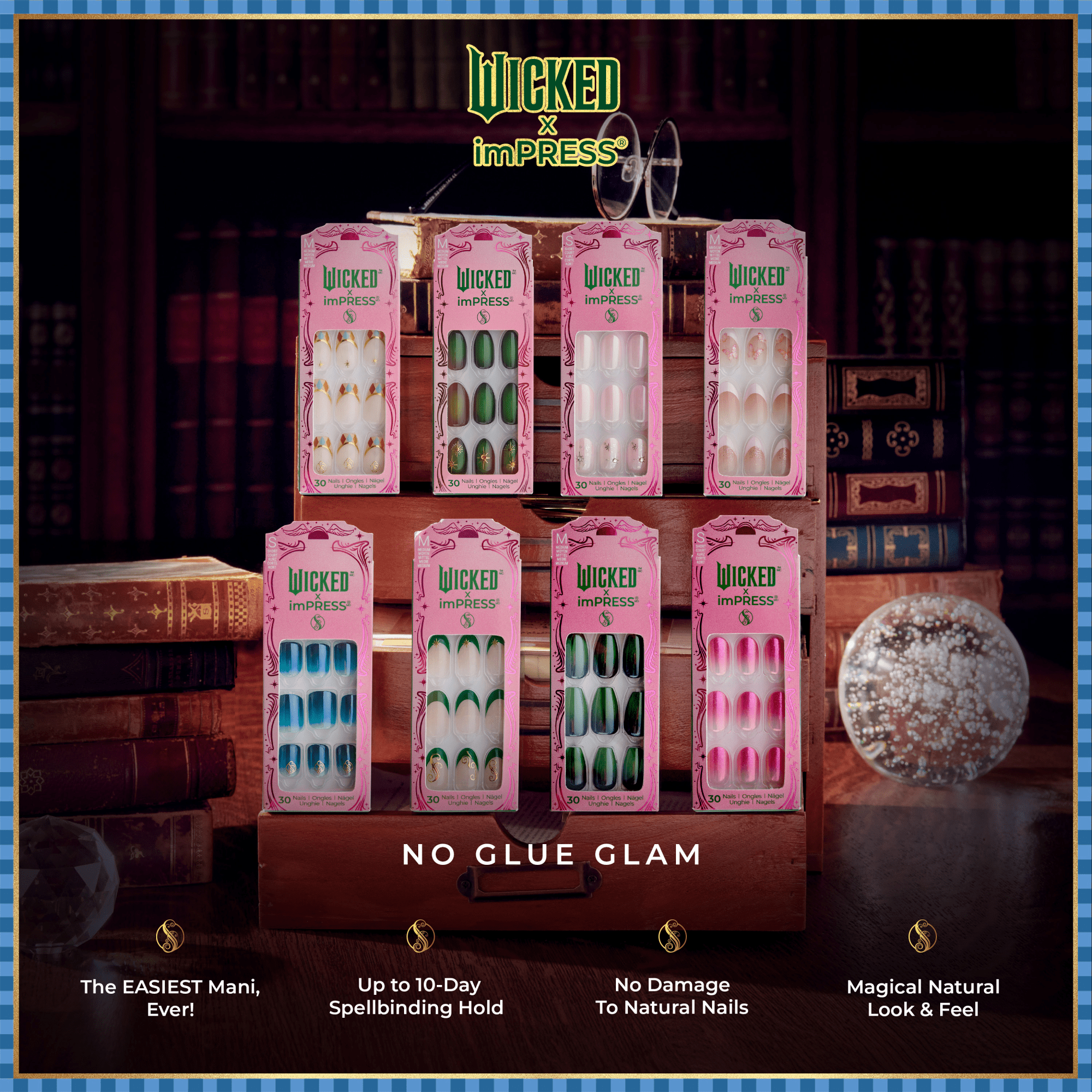 Eight pink-packaged Wicked x imPRESS press-on nail sets displayed on a wooden stand with a vintage book backdrop, showcasing various nail designs and the tagline \