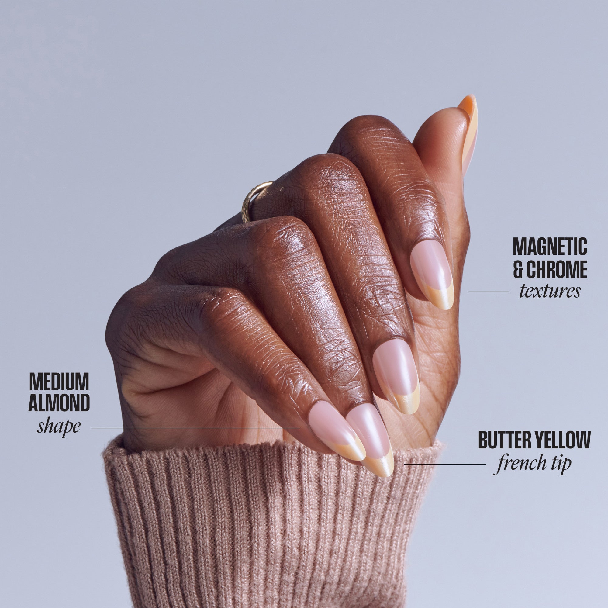 Medium almond nails with butter yellow French tips and magnetic chrome textures on deep skin tone.