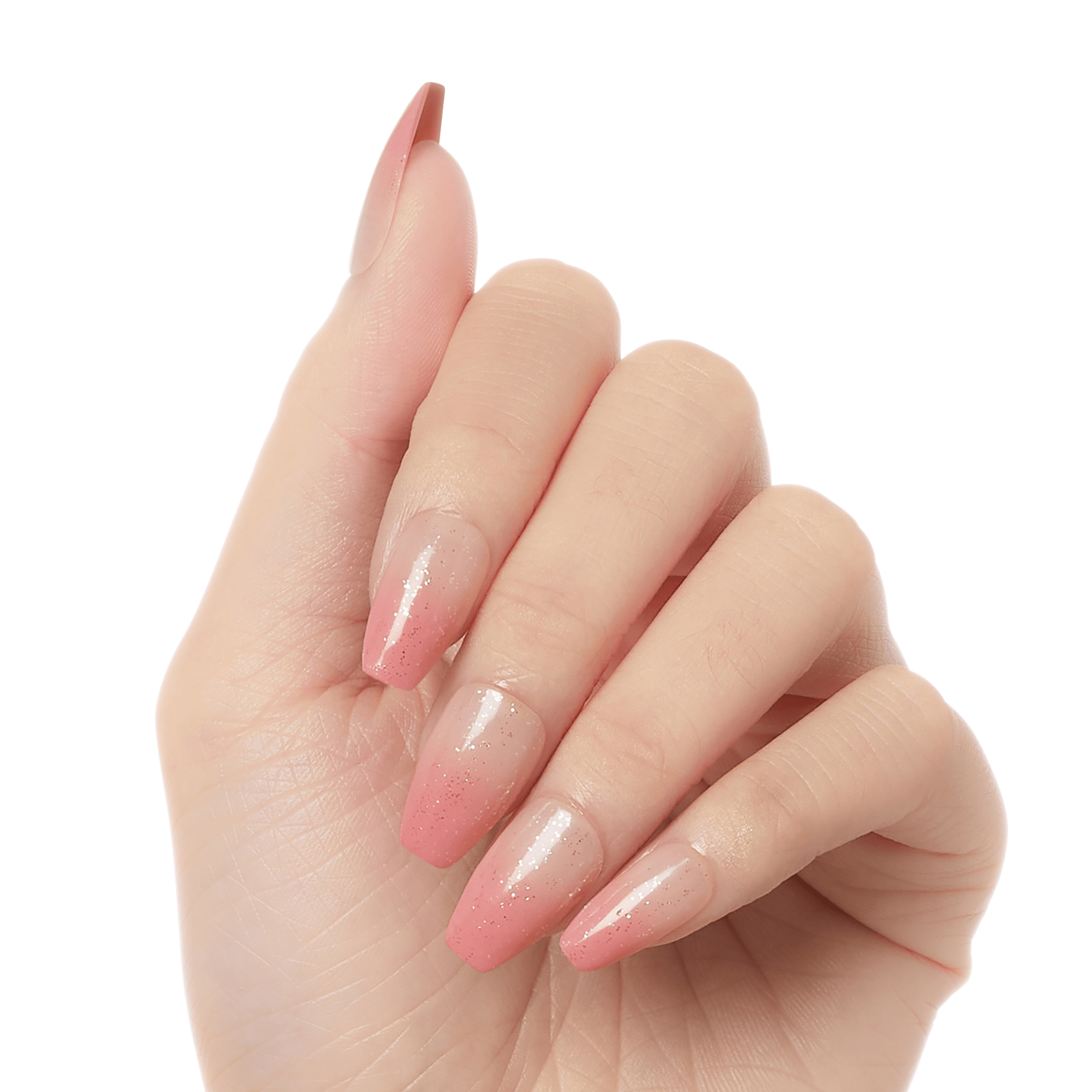 Hand showing five press-on gel nails with an ombre design fading from clear nude at the base to soft pink tips with subtle sparkles.