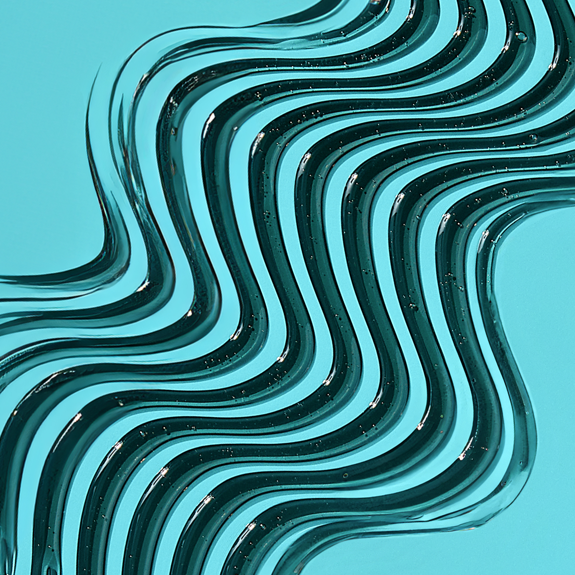 Black gel liquid swirled in wavy lines on a light blue surface, showing texture and small bubbles in the product.