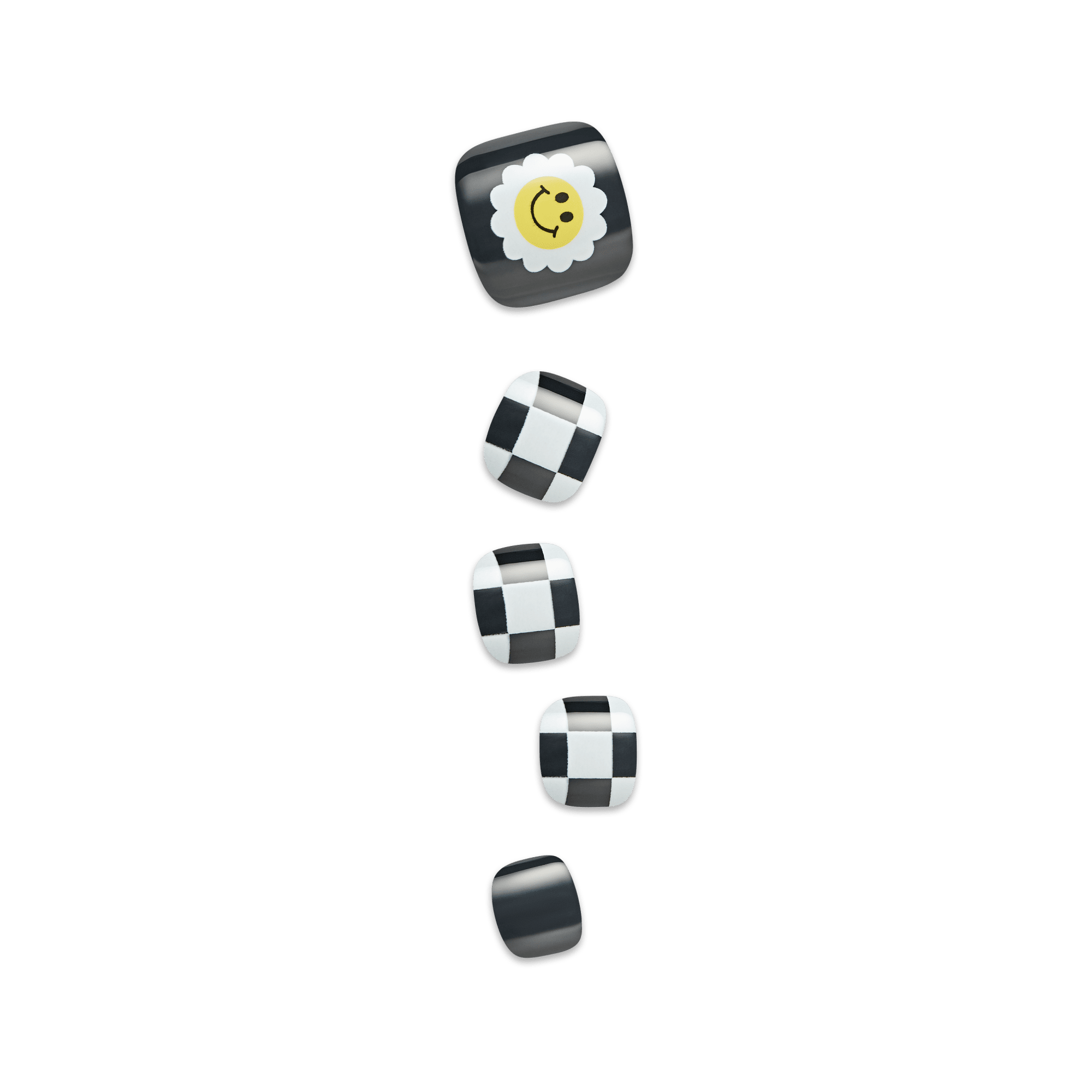 Five press-on toenails in black and white designs, featuring a smiling yellow daisy on the largest nail and black-and-white checkered patterns on the others.