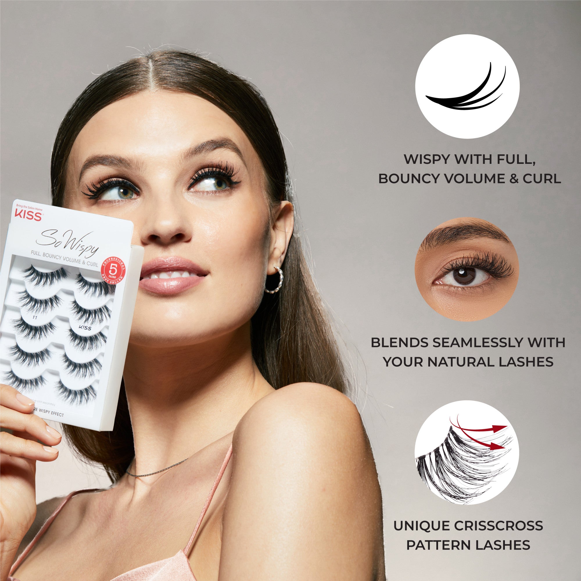 Woman with long brown hair wearing wispy false lashes, holding KISS So Wispy Lash Multipack with five pairs; text highlights full volume, seamless blend, and crisscross pattern.