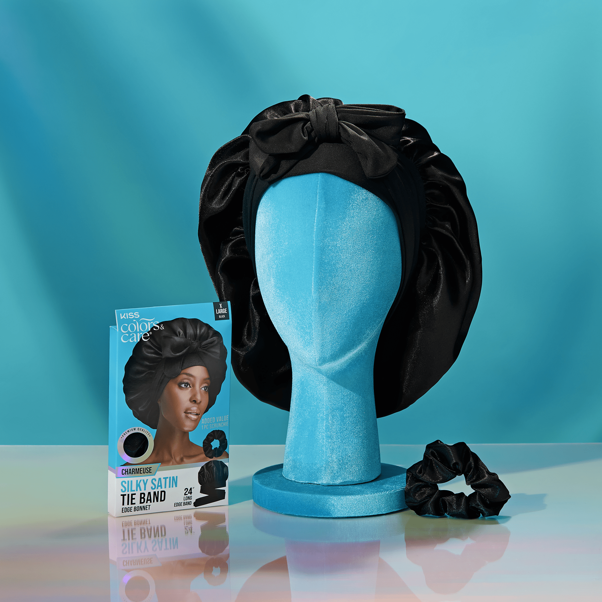 Kiss Colors & Care Silky Satin Tie Band displayed on blue mannequin head with product box.