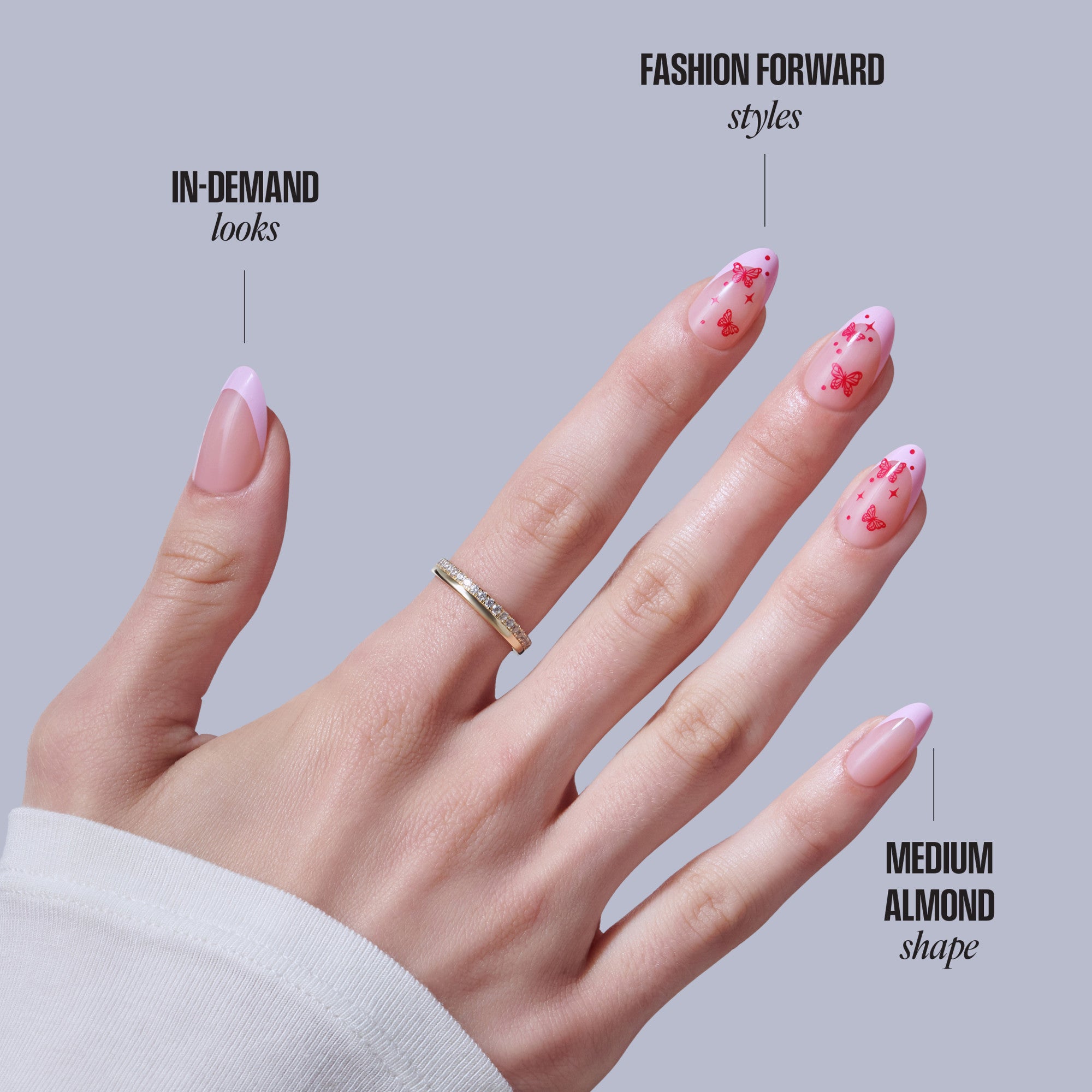 Pink almond nails with butterfly design; in-demand look vs fashion forward styles comparison.