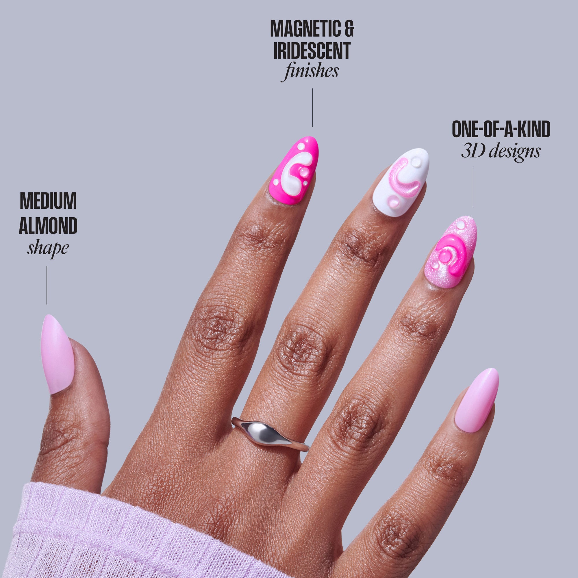 Medium almond nails with magnetic pink and white 3D designs featuring swirls and dots.
