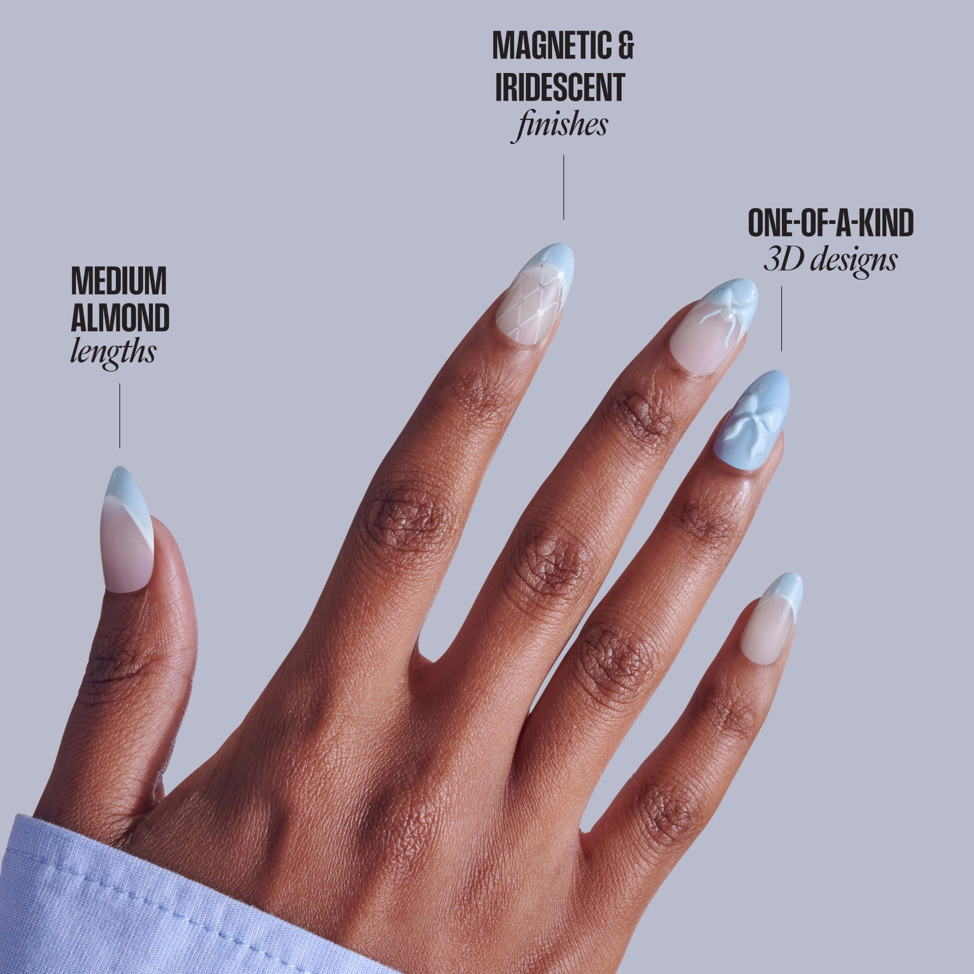 Hand displaying medium almond press-on nails with iridescent blue tips and 3D designs.