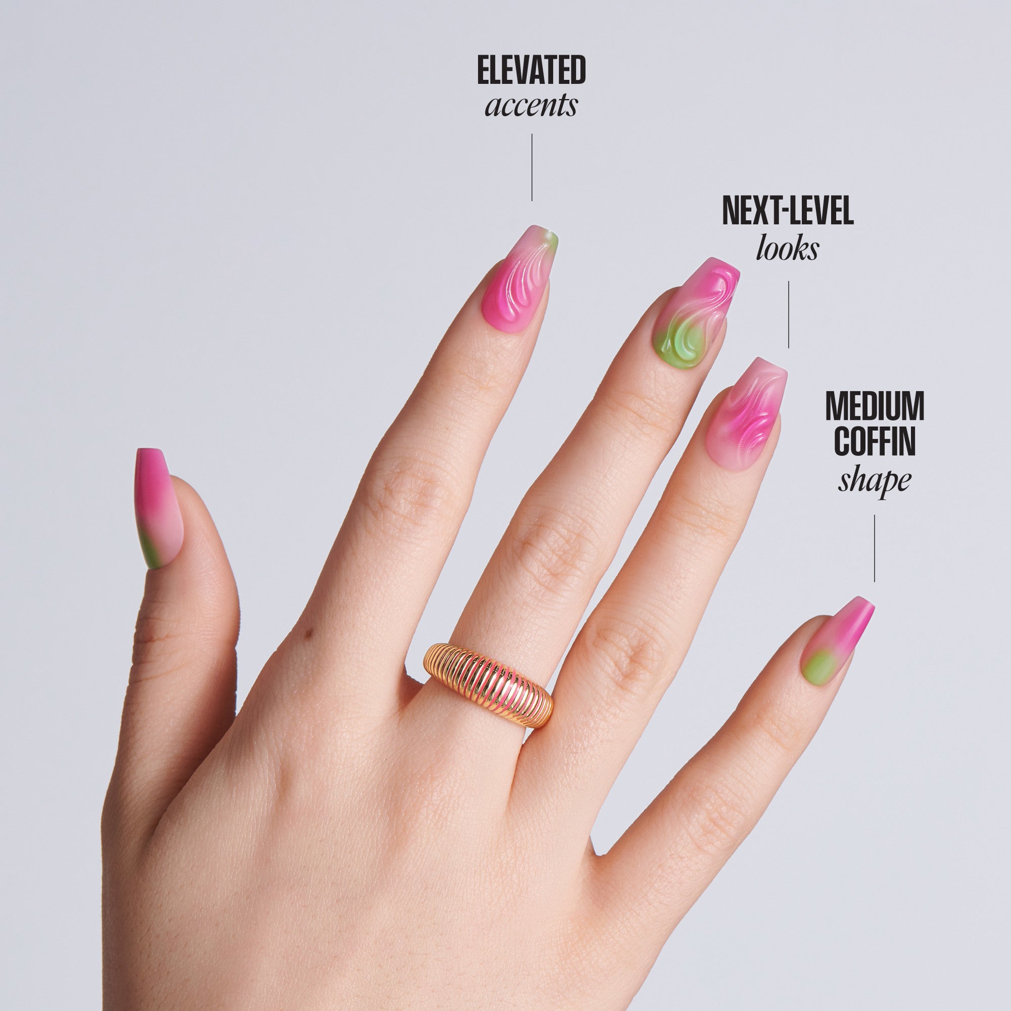 Hand with medium coffin-shaped nails featuring pink and green marble swirl designs with gold accents and a gold ring, with text: Elevated Accents, Next-Level Looks, Medium Coffin Shape