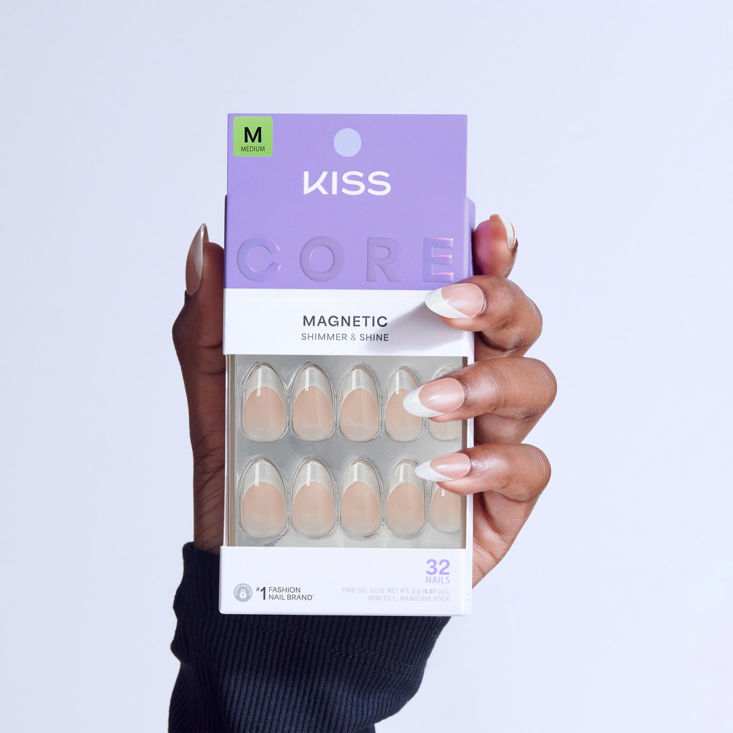 KISS Core Magnetic Shimmer &amp; Shine press-on nails in medium size, displayed on hand.