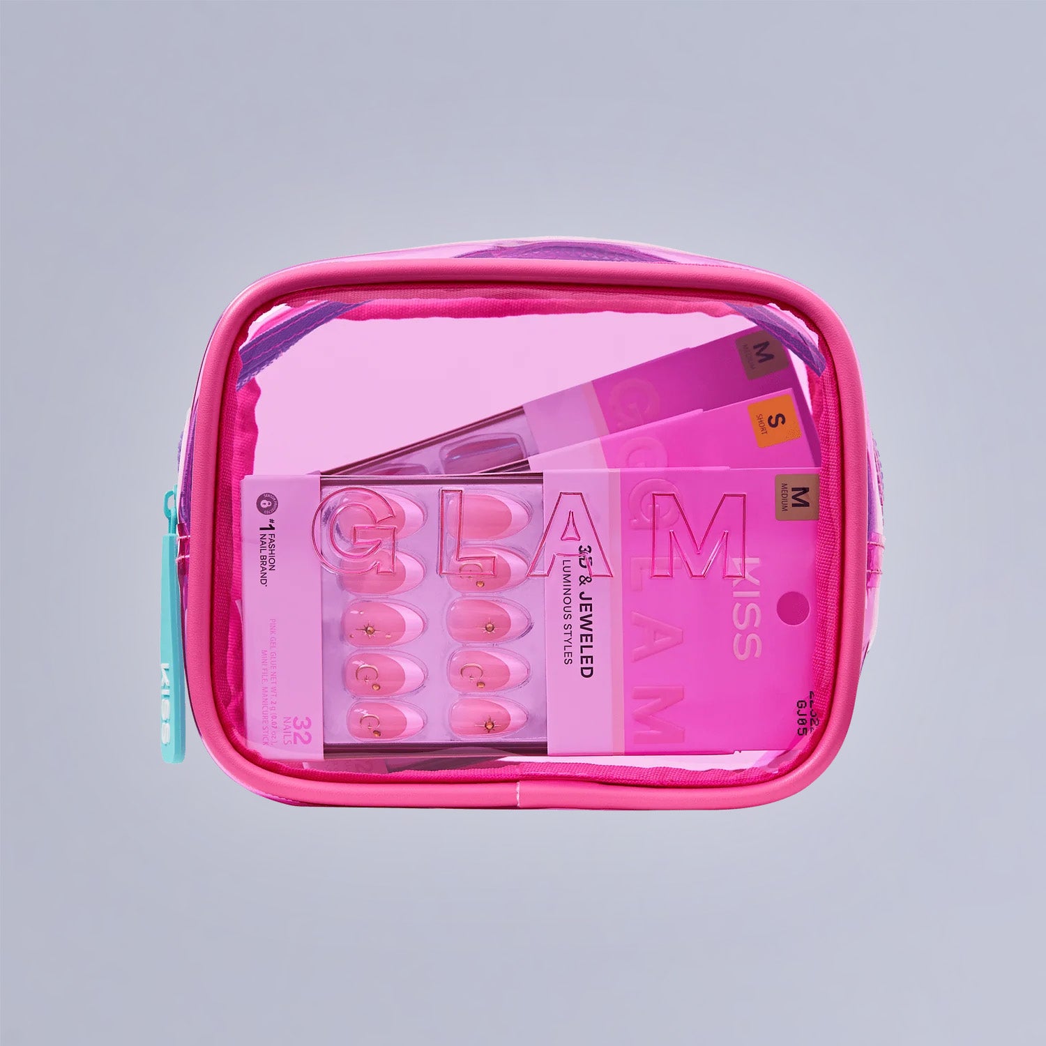Pink cosmetics bag containing GLAM Miss beauty set with eyeshadow palette and brushes.