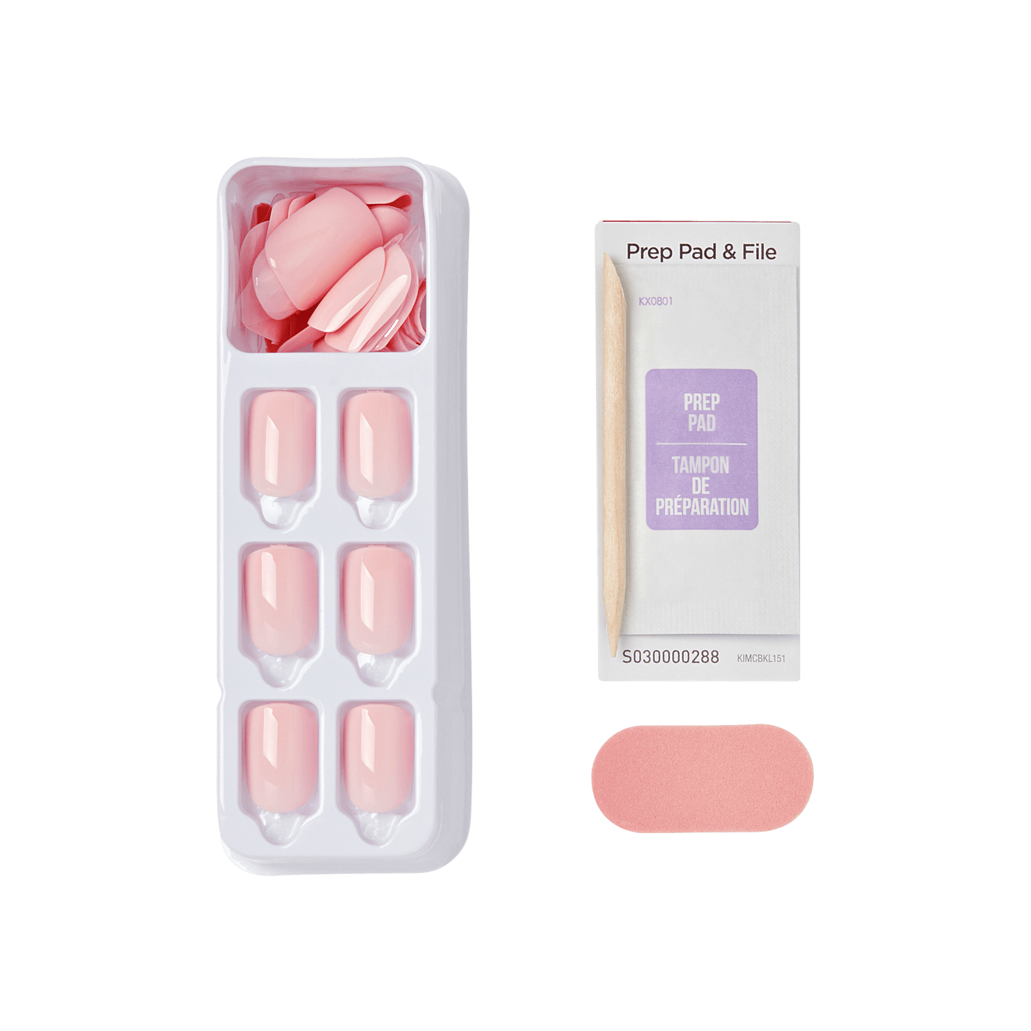 Tray of glossy light pink press-on nails labeled Pick Me Pink, accompanied by a wood cuticle stick, prep pad packet, and pink nail file.