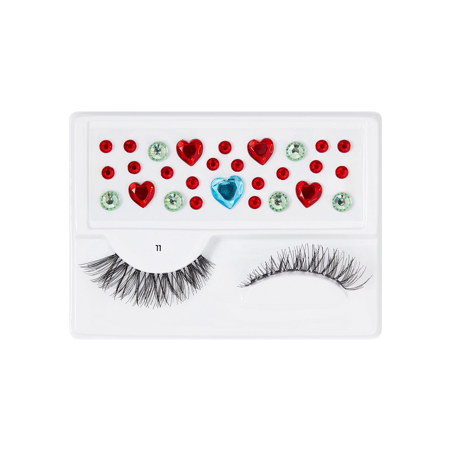 The image features a makeup accessory set that includes a pair of false eyelashes and decorative gems. The eyelashes are styled with a dramatic, feathery look, while the accompanying gems are arranged in a playful pattern. The gems include red hearts, green circular shapes, and a blue gem, all set against a white background. This combination creates a vibrant and fun aesthetic, perfect for adding flair to makeup looks.