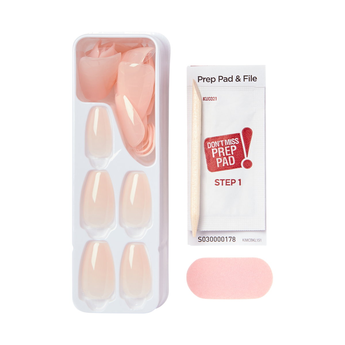 Tray of light pink press-on nails in various sizes, alongside a wooden cuticle stick, a pink nail file, and a prep pad packet labeled \