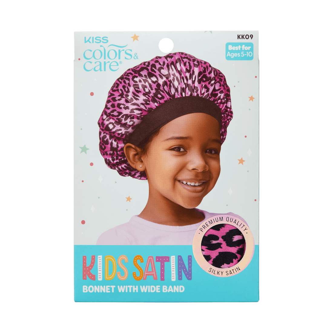 Smiling young girl wearing a pink satin bonnet with a black wide band and pink leopard print, displayed on KISS Colors &amp; Care packaging for kids ages 5-10.