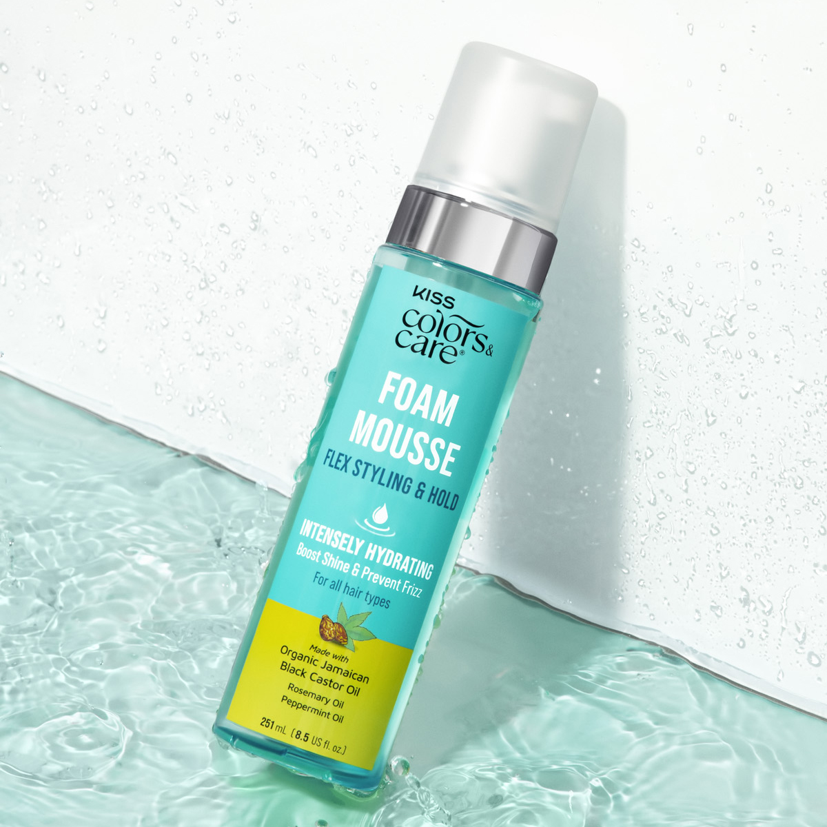Turquoise bottle of KISS Colors &amp; Care Foam Mousse with silver pump, labeled intensely hydrating with Jamaican black castor, rosemary, and peppermint oils.