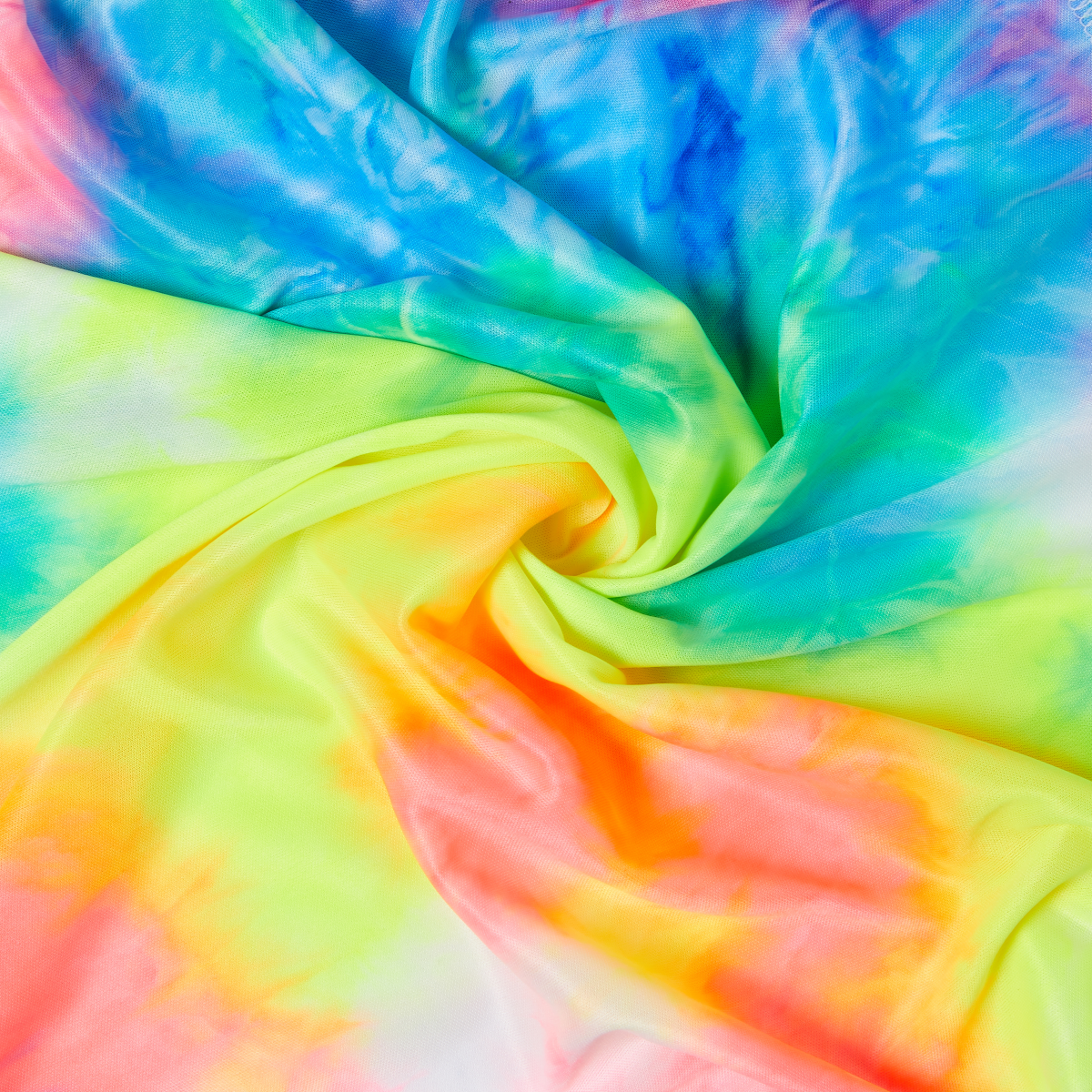 Soft satin wrap scarf with a vibrant tie-dye pattern in blue, green, yellow, and orange, shown twisted to highlight fabric texture and colors.