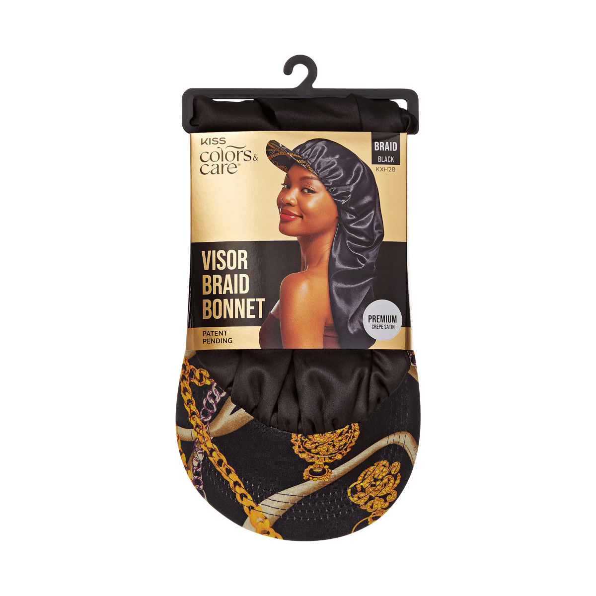 KISS Colors &amp; Care silky satin visor braid bonnet in black with gold chain print visor, shown in packaging with smiling model wearing the bonnet.