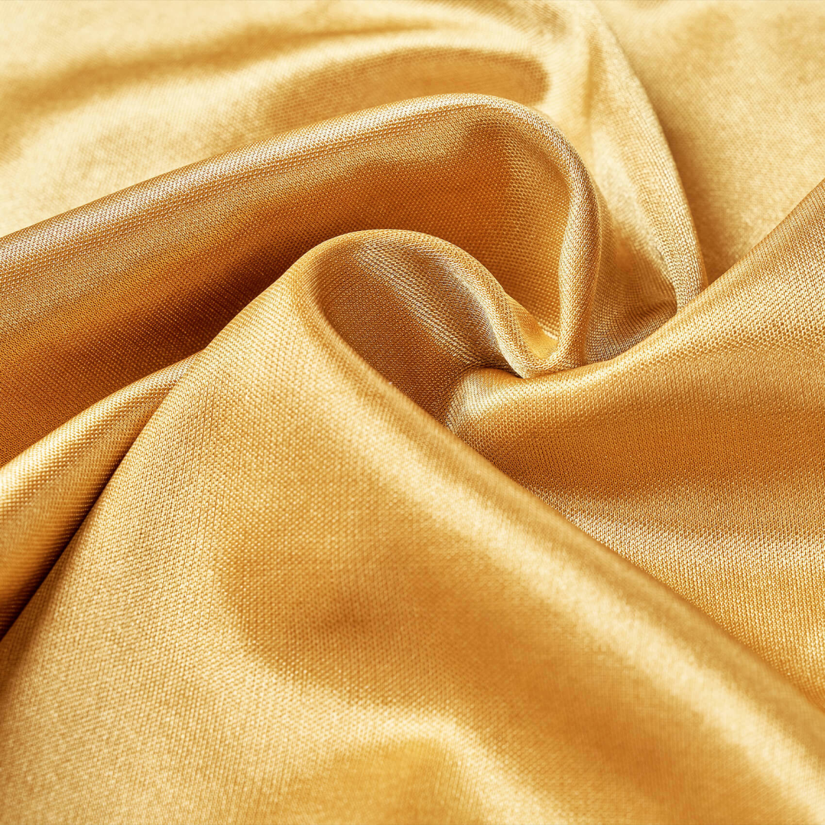 Close-up view of smooth, shiny gold satin fabric with soft folds and a subtle woven texture, representing the Power Wave Satin Durag material.