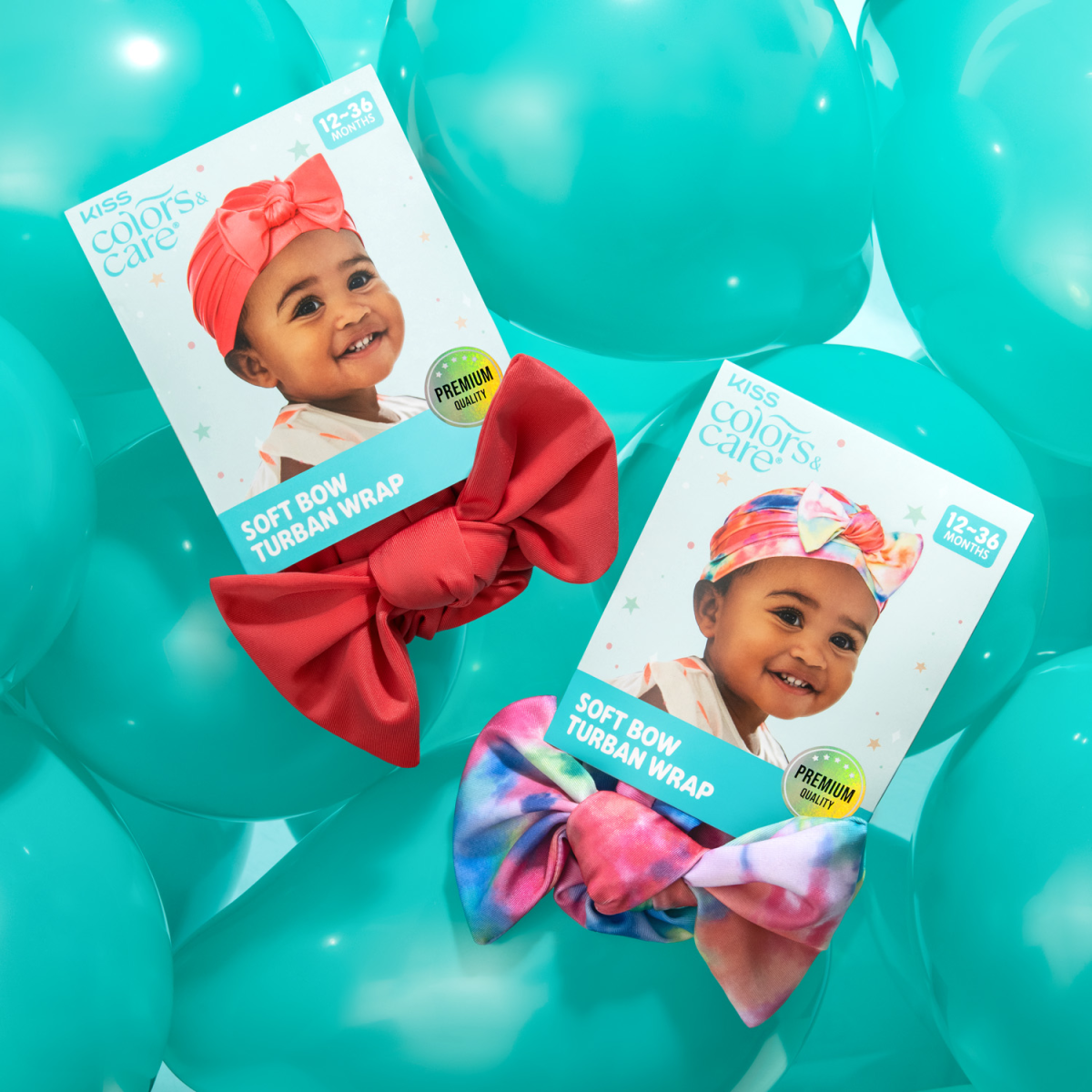 Two toddler-sized turbans with large pre-tied bows on blue balloons; one solid coral and one tie-dye, each on packaging showing a smiling toddler wearing the wrap. Text includes \