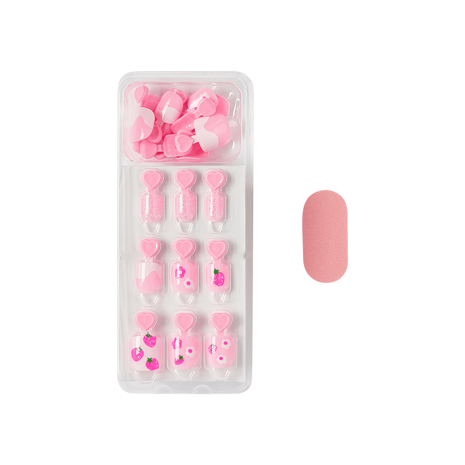 The image features a set of artificial nails displayed in a clear plastic packaging. The nails are predominantly pink and include various designs, such as heart shapes and floral patterns. There are several different styles, with some nails featuring glitter and others adorned with small decorative elements. Additionally, a pink nail file is included in the packaging, positioned next to the set. The overall aesthetic is playful and feminine, perfect for a fun manicure.